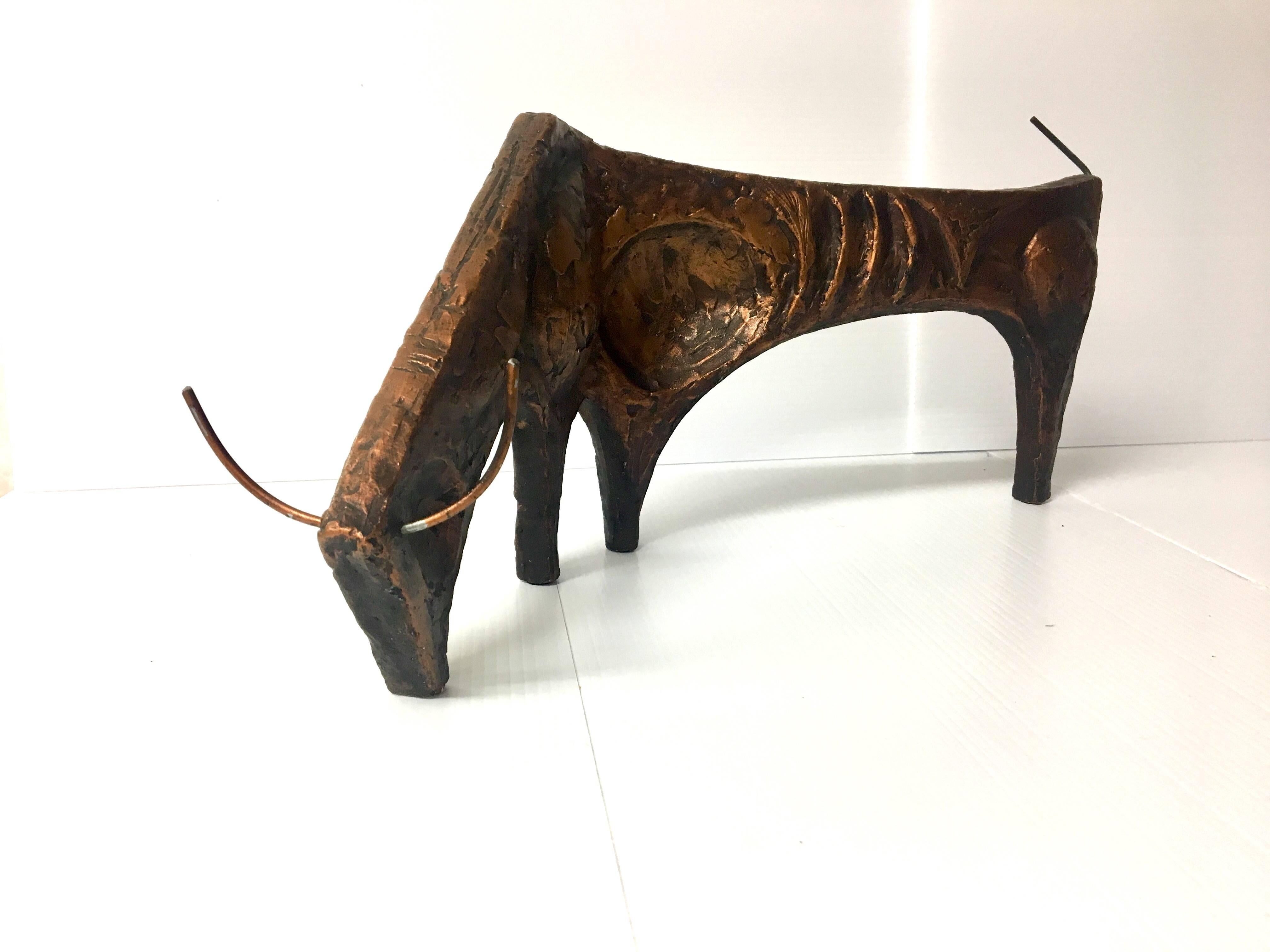 Unique and rare Brutalist bull sculpture, Picasso style, signed By Willem Degroot and produced by Austin Products, circa 1967. It is a very impressive and beautiful piece made of plaster in a faux copper finish with wire tail and horns.