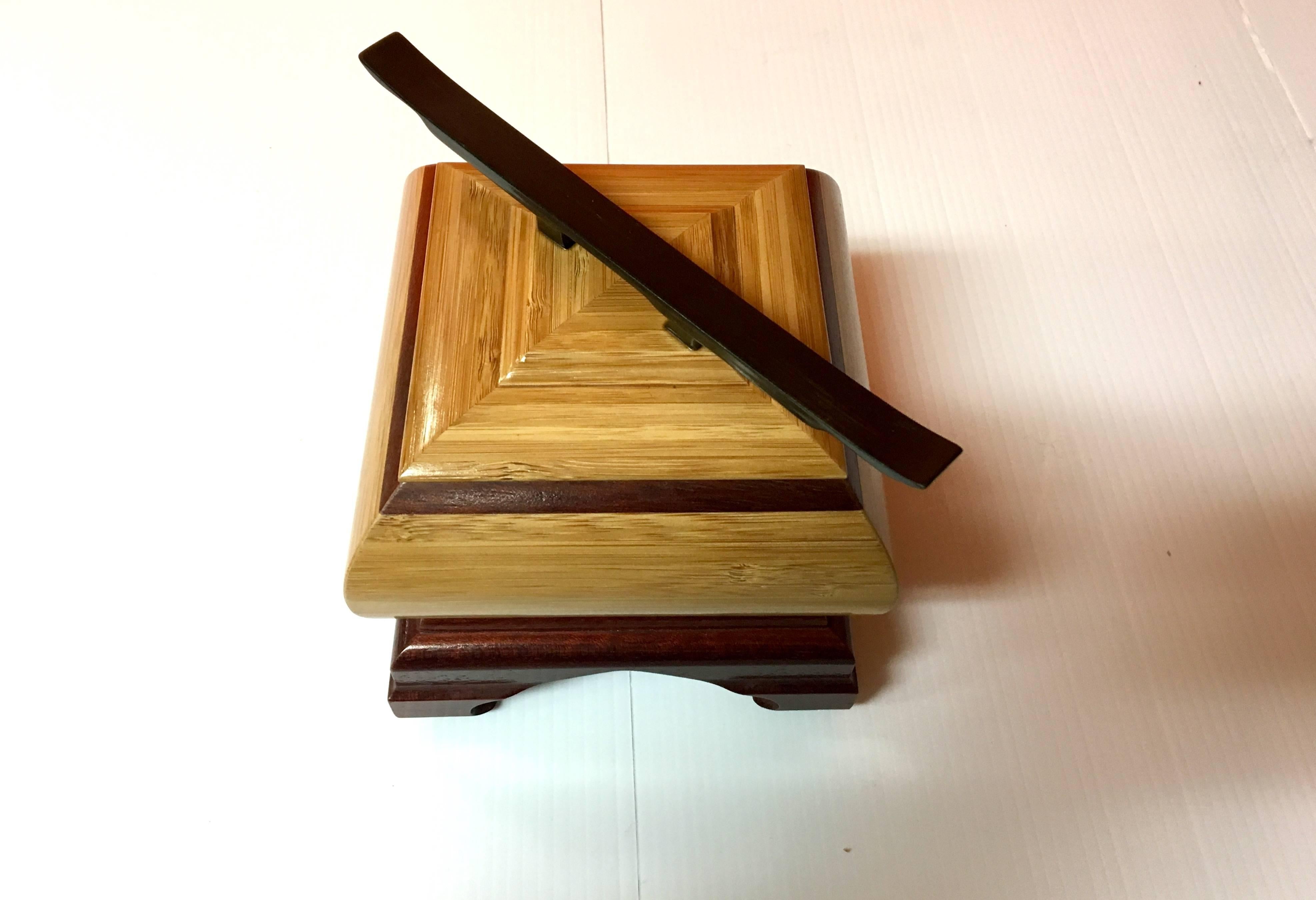 A unique walnut jewelry box handcrafted and signed by the artist in 2006. The box is a mix of mahogany, oak, cherry and ebony woods. Elegant design and styling. Truly a work of art!
