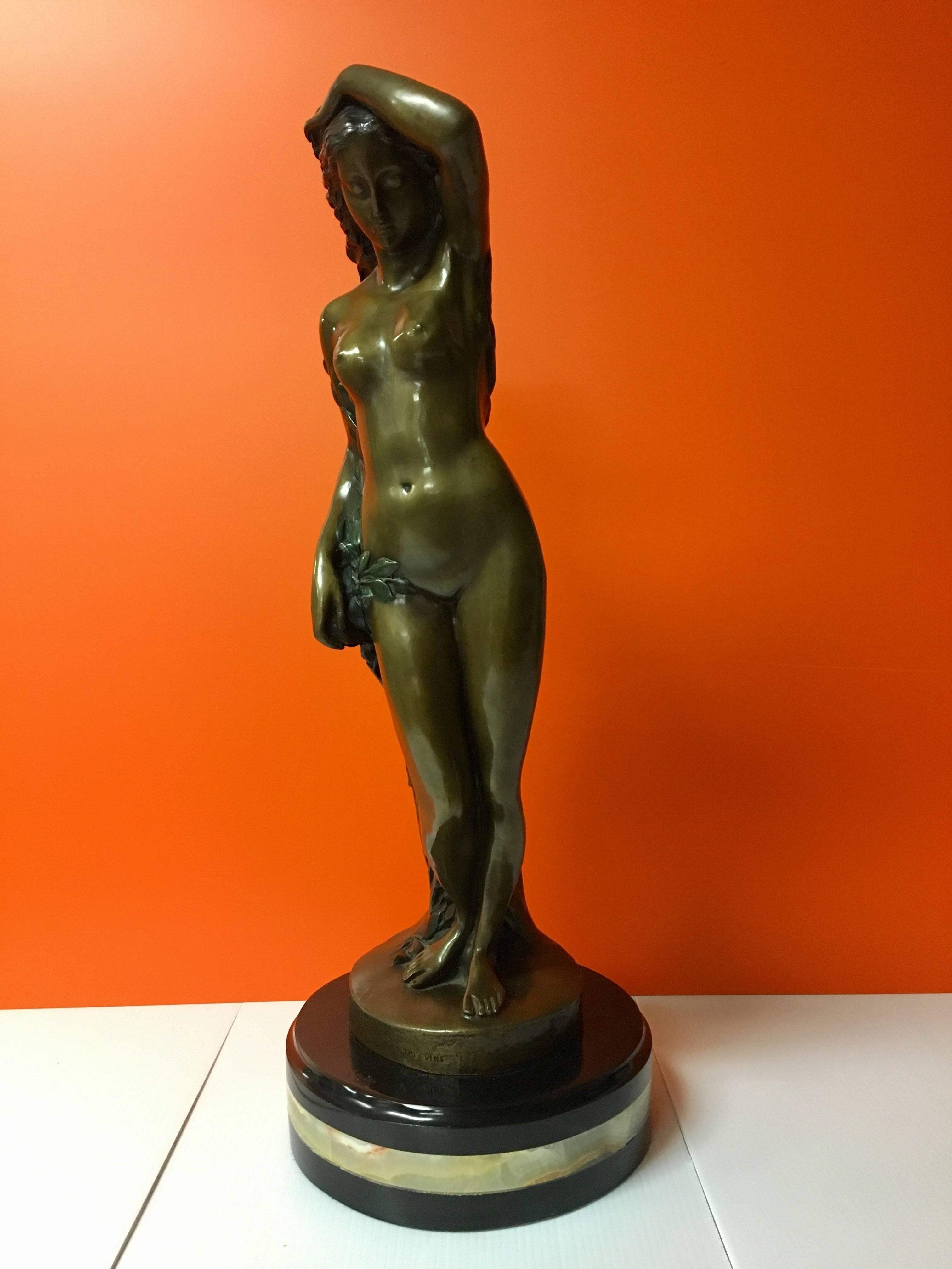 Well cast and impressive sculpture of a nude woman entitle "The Vine" numbered 9/100. Bronze cast on solid marble base. Measures: 24" high.