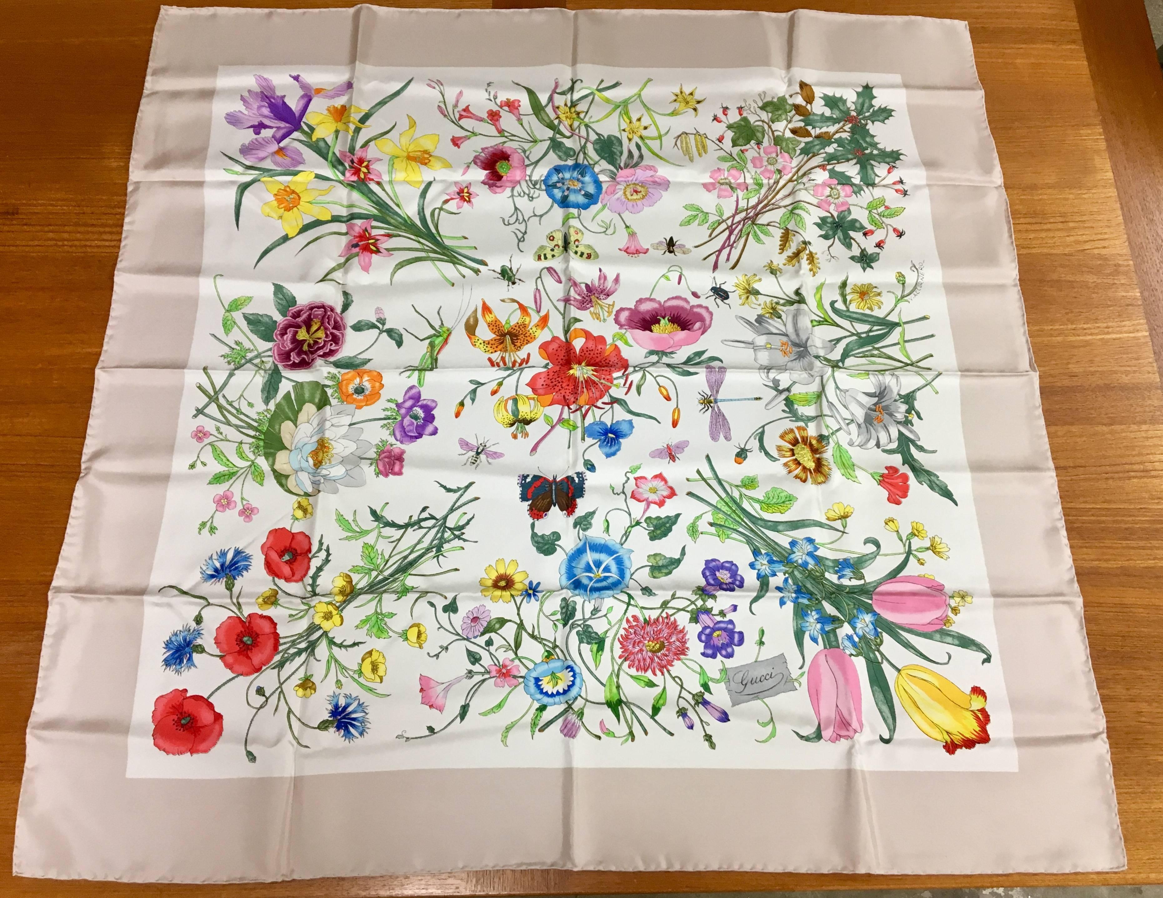 Elegant, vintage, Gucci, hand rolled silk scarf with original Gucci box. The scarf has never been used and is in excellent condition. The piece is signed and was designed in a floral pattern by Accornero. It was purchased in Florence, Italy in the