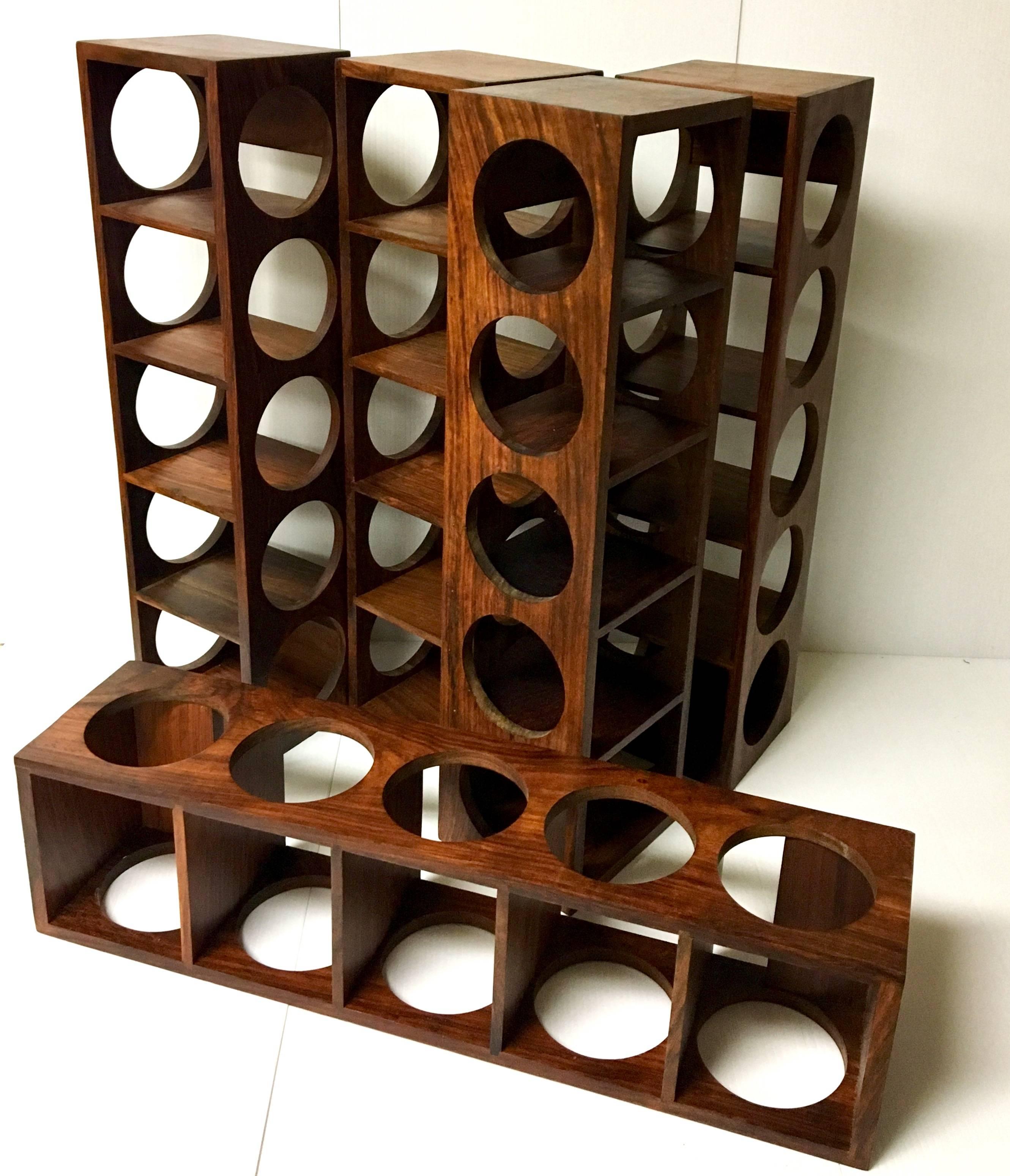 A rare Danish modern, five bottle capacity, solid rosewood wine. The racks are easy to install and in great condition. Five racks are available and they are priced individually; buy 1 or all 5!