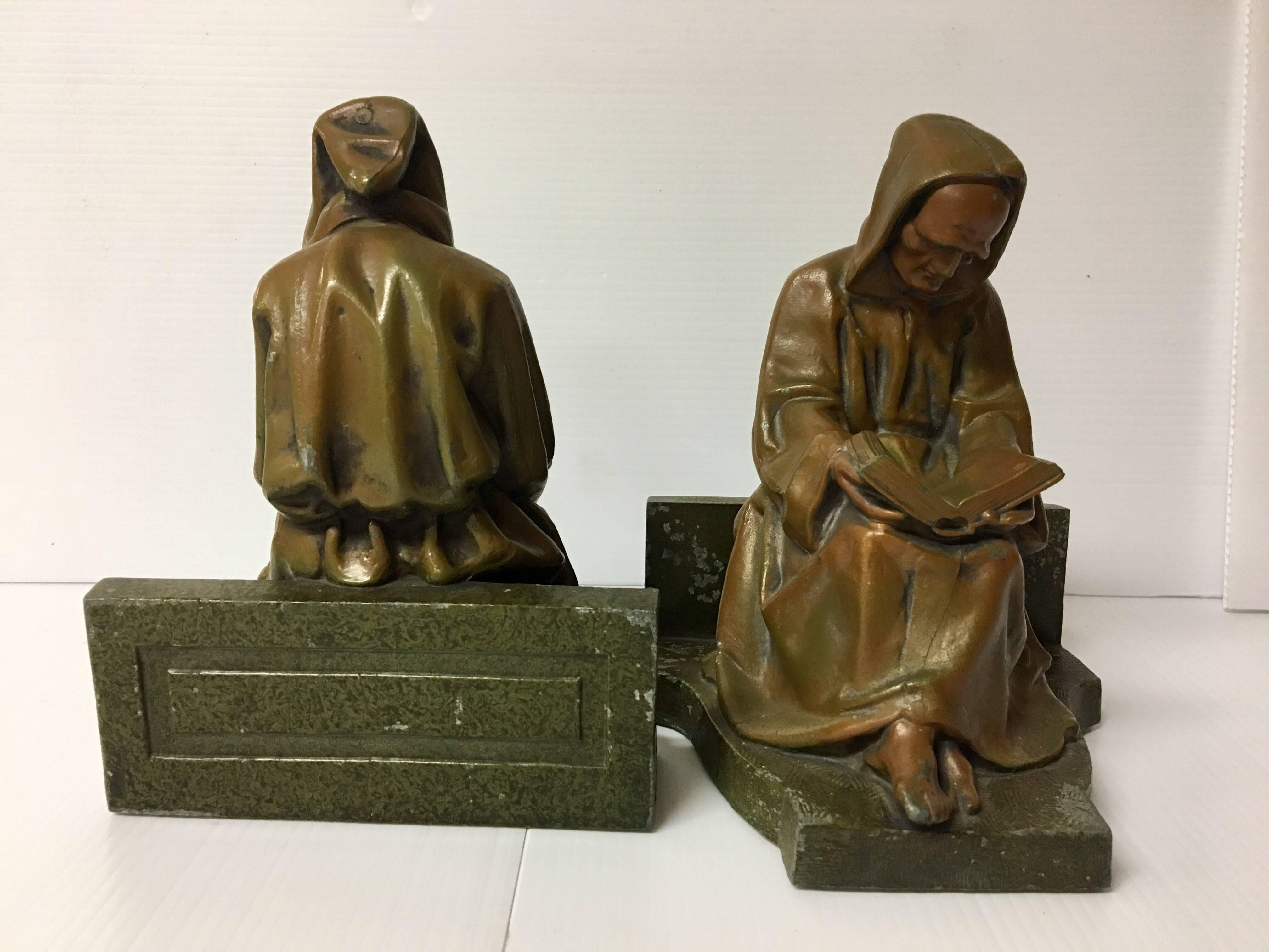 Antique pair of bronze finish monk / scholar reading bookends. Some chips on the finish, nice detail on cast metal.