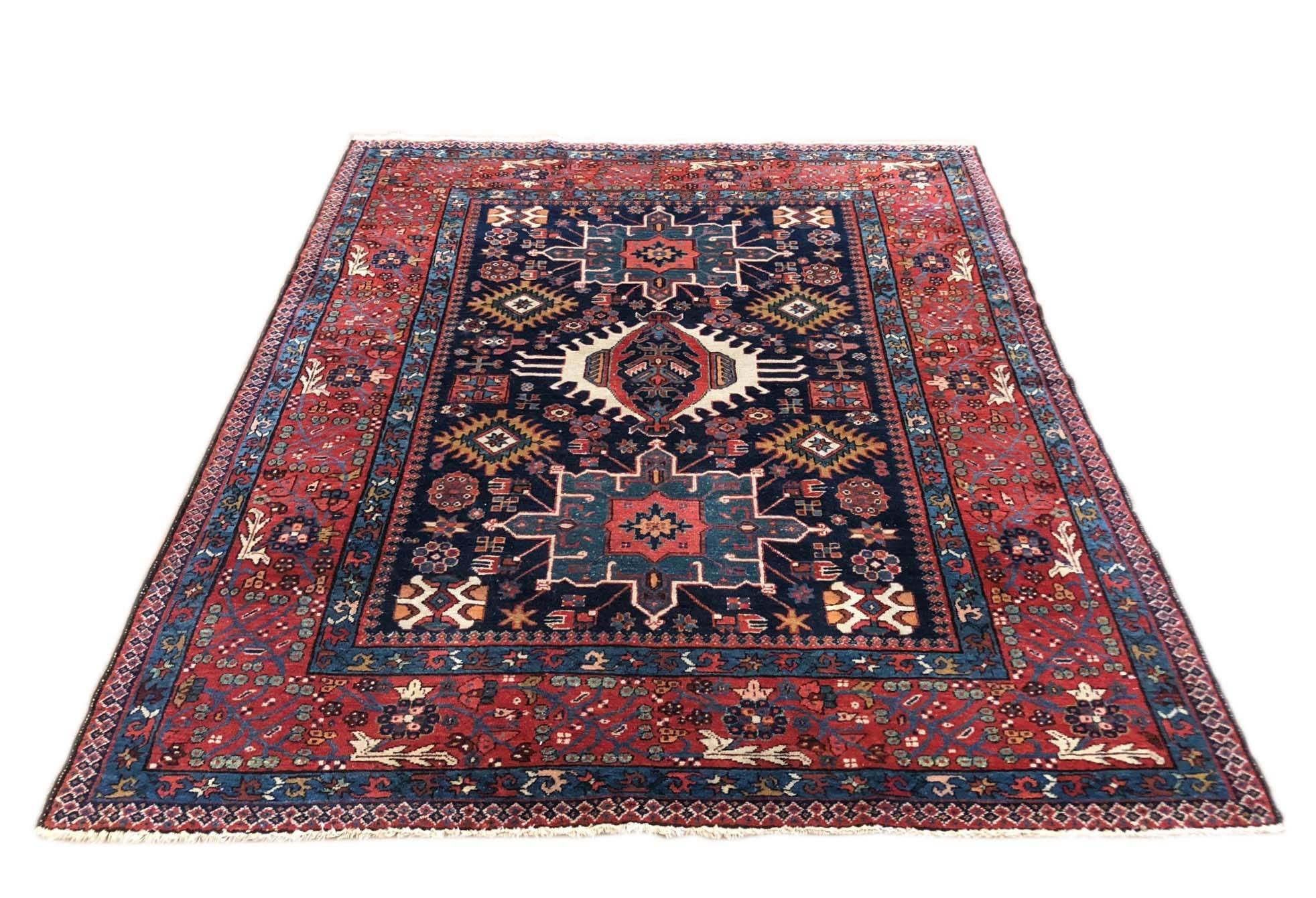 This piece is from Karadja a village from Northeast of Azerbaiyjan. A unique rug of three rows medallions is an antique piece from 20th century. This rug has a great color combination, everything is a harmony in this antique piece. This rug has a