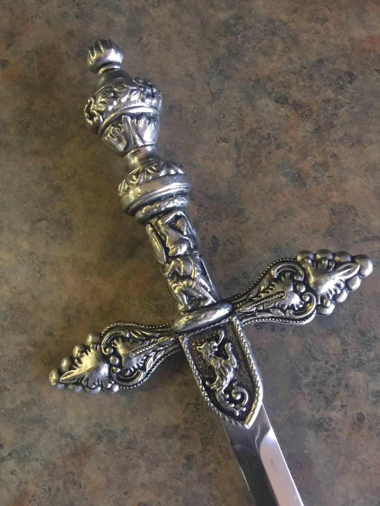 Spanish silver plated letter opener in the shape of a vintage sword. The piece is in very good vintage condition and is well weighted and 9.5