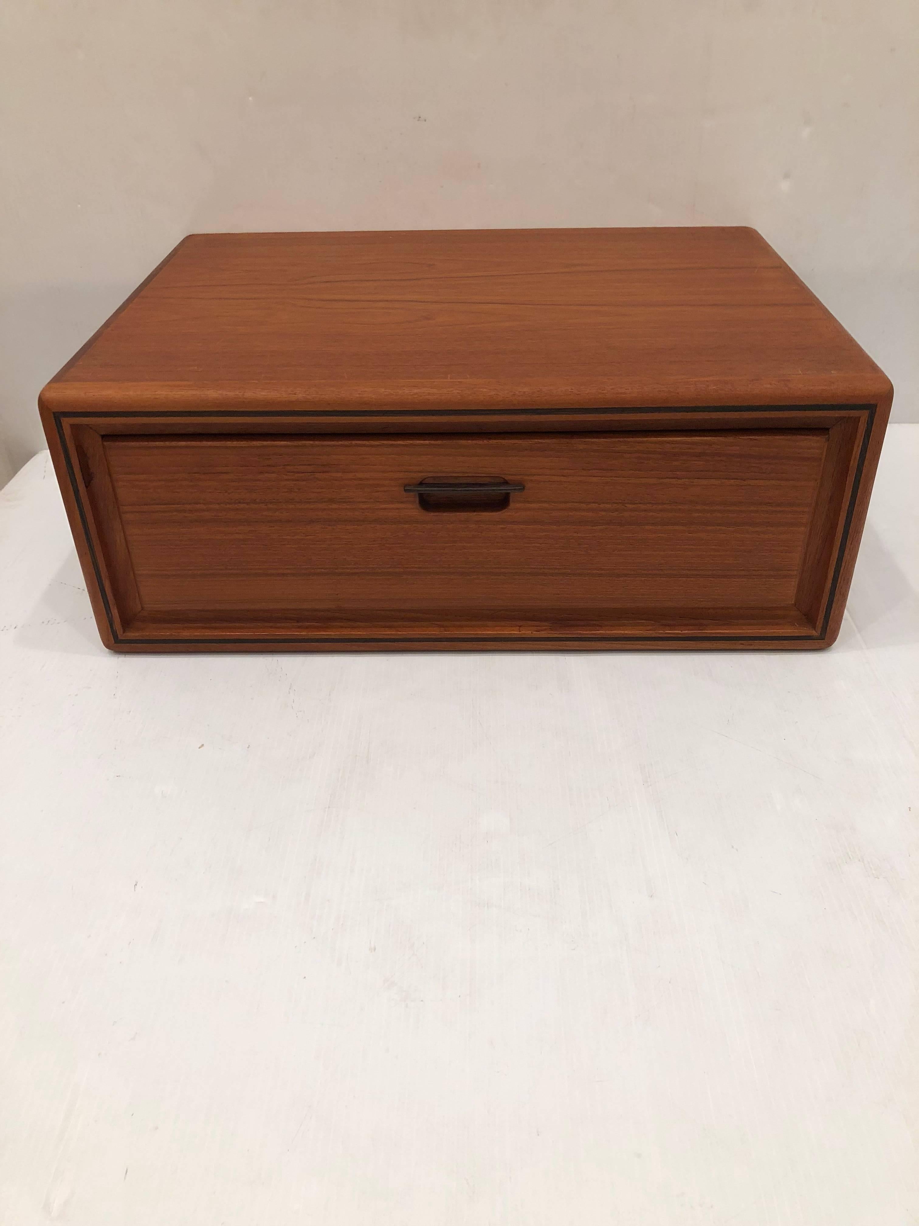 Beautiful pair of wall hanging floating nightstands, circa 1960s high quality pieces single drawer, with rosewood handle and trim edge, freshly refinished, practical and elegant.