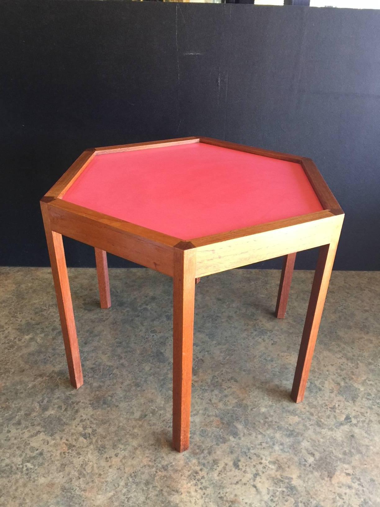 Functional teak and red laminate octagonal side table by Hans Andersen, circa late 1950s.