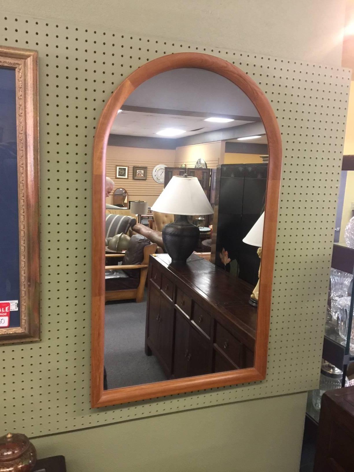 Large and impressive arched top teak mirror by Jesper International, circa 1970s. Very well constructed piece with finished back and dovetailed frame.