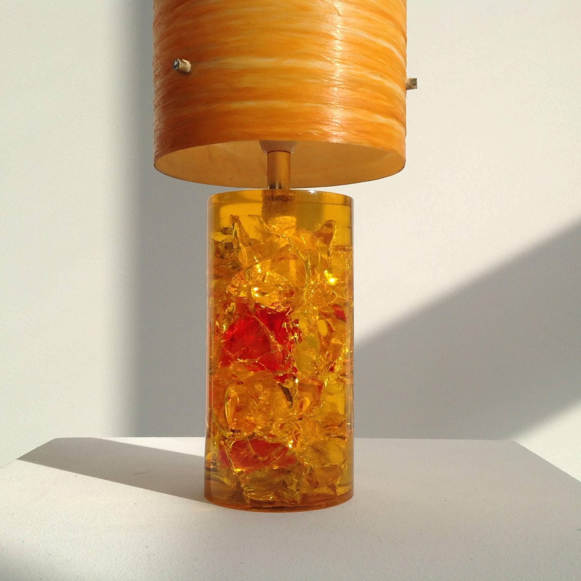 Very elegant and simple desk or table lamp, pretty line, special lighting.
Base made of orange crackle resin with red accents.
One bulb in a small French fitting, with on/off switch, controlled and okay for the US.
Lampshade in orange and made of