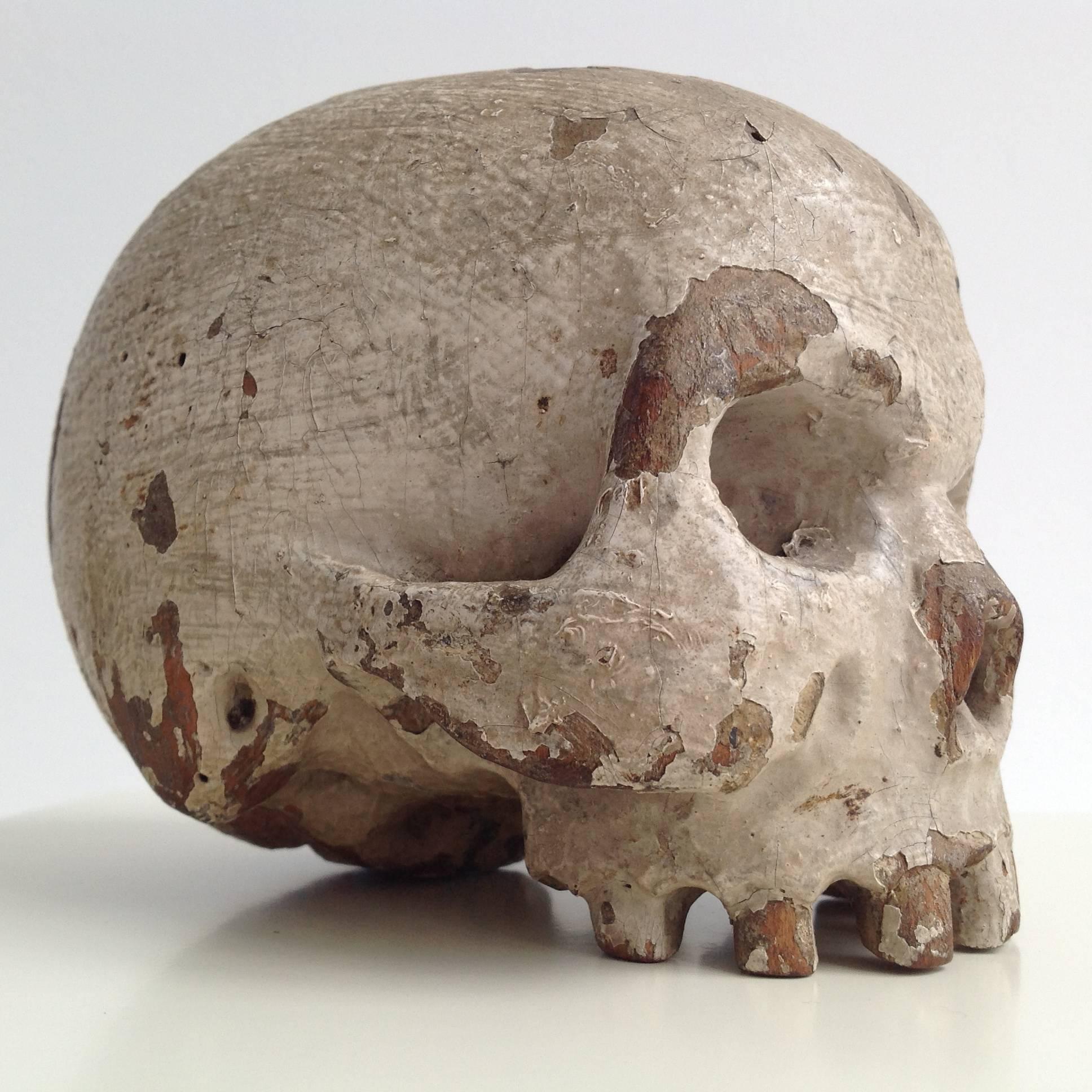 Extremely rare little skull of solid wood from the 18th century.
Beautiful and realistic handmade piece of art, stunning decoration.
It's a piece from a private collection, the origin is never outdated.
It suggests that it comes from a very old