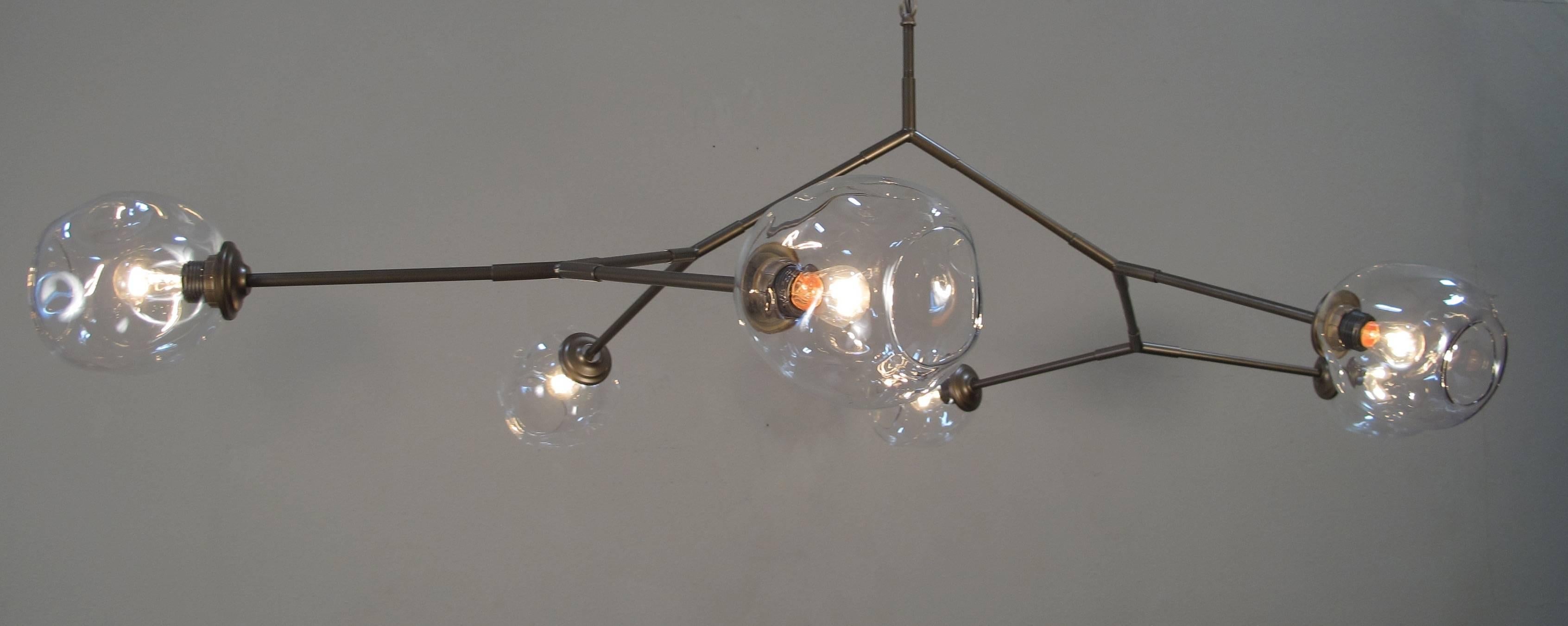 Six-light handblown glass fixture shown in painted bronze finish. Six lights. Made to order, 4-6 week lead time. Other finish options and sizes available. Finish in last picture is matte black.