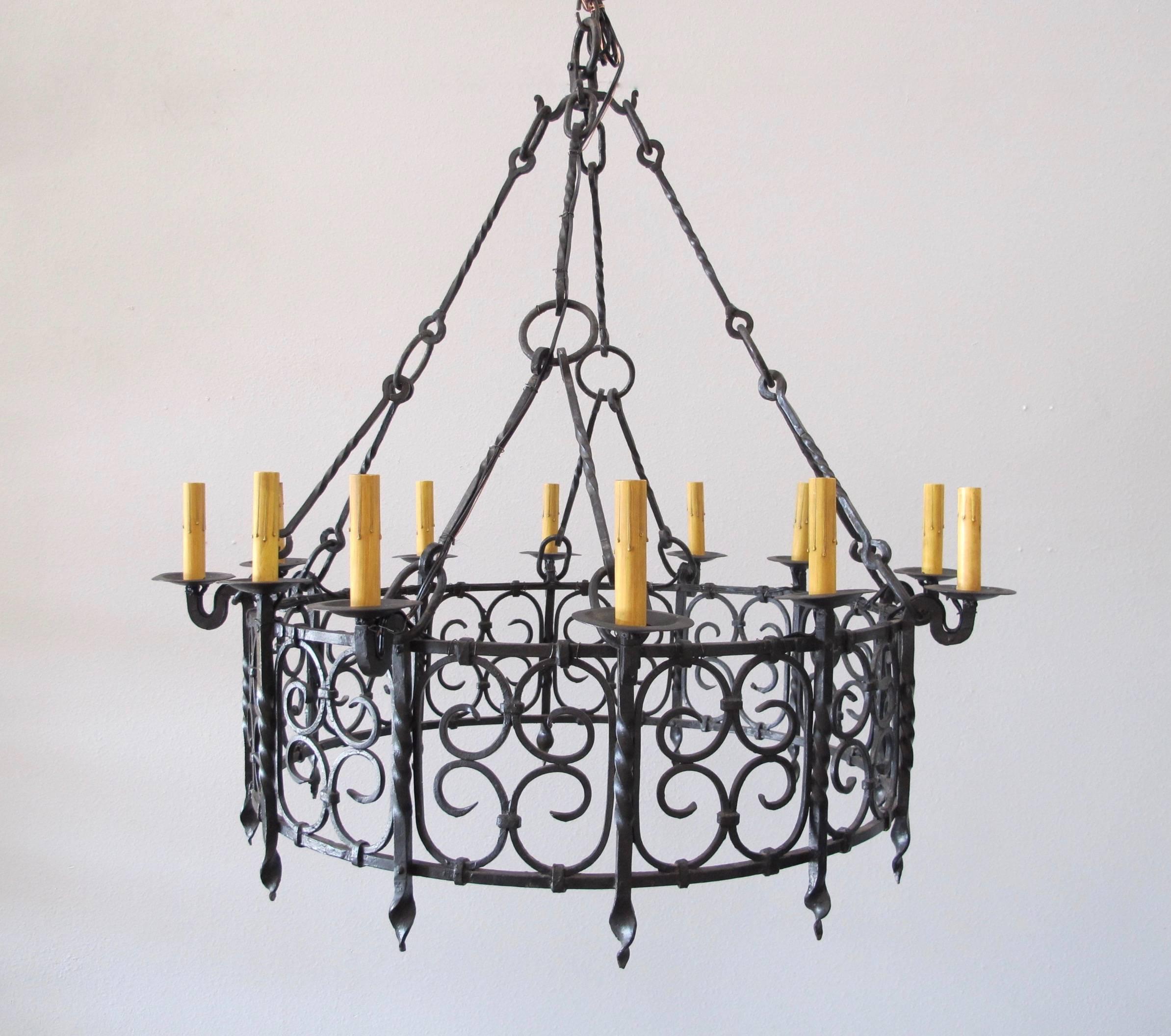 Gorgeous wrought iron chandelier in excellent condition. All wiring has been replaced and is UL approved with chain and canopy. Courtesy to the trade. Marked down 20% off original price. 