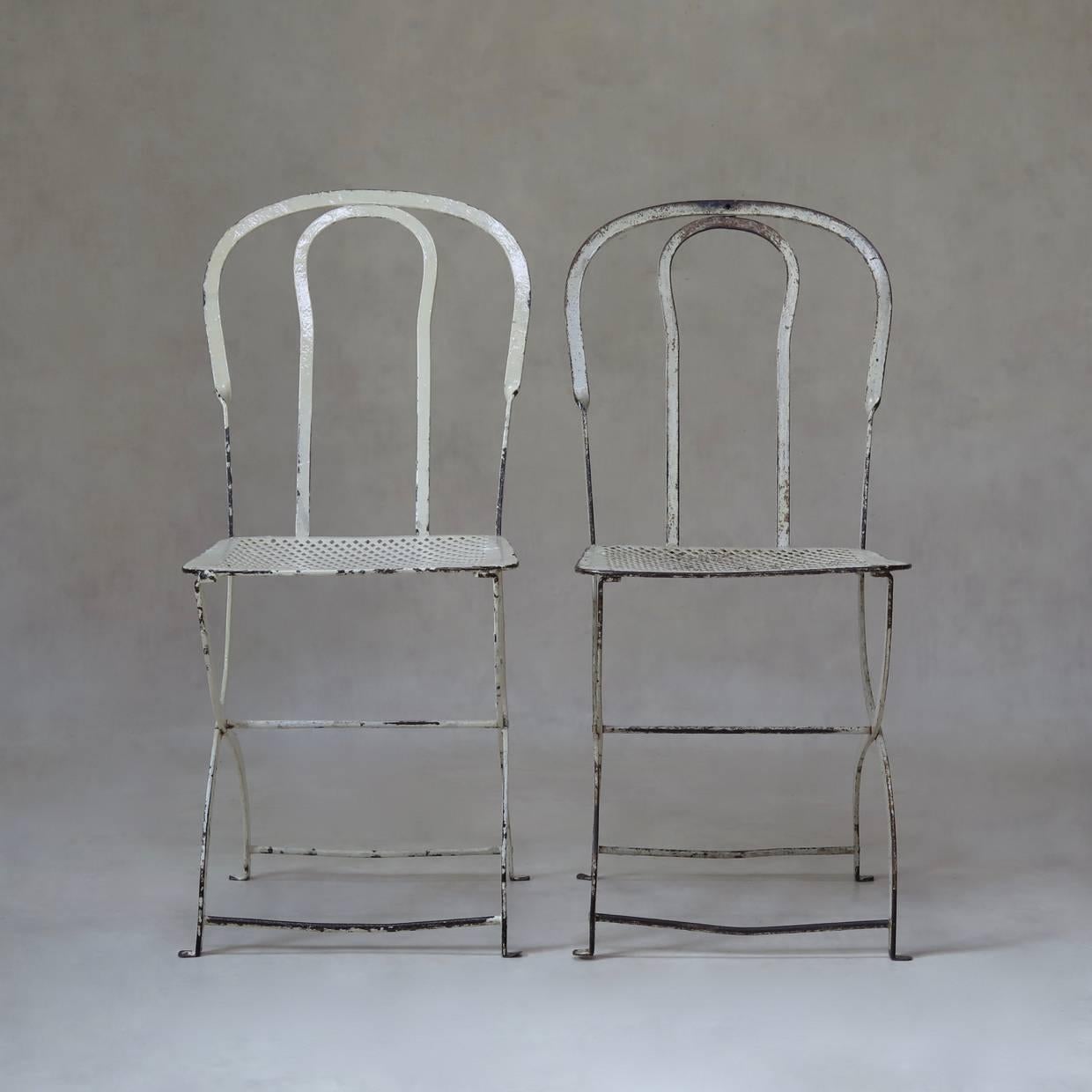 This garden chair is a Classic of French chic, understated style and quality. Made of iron, with original white paint.