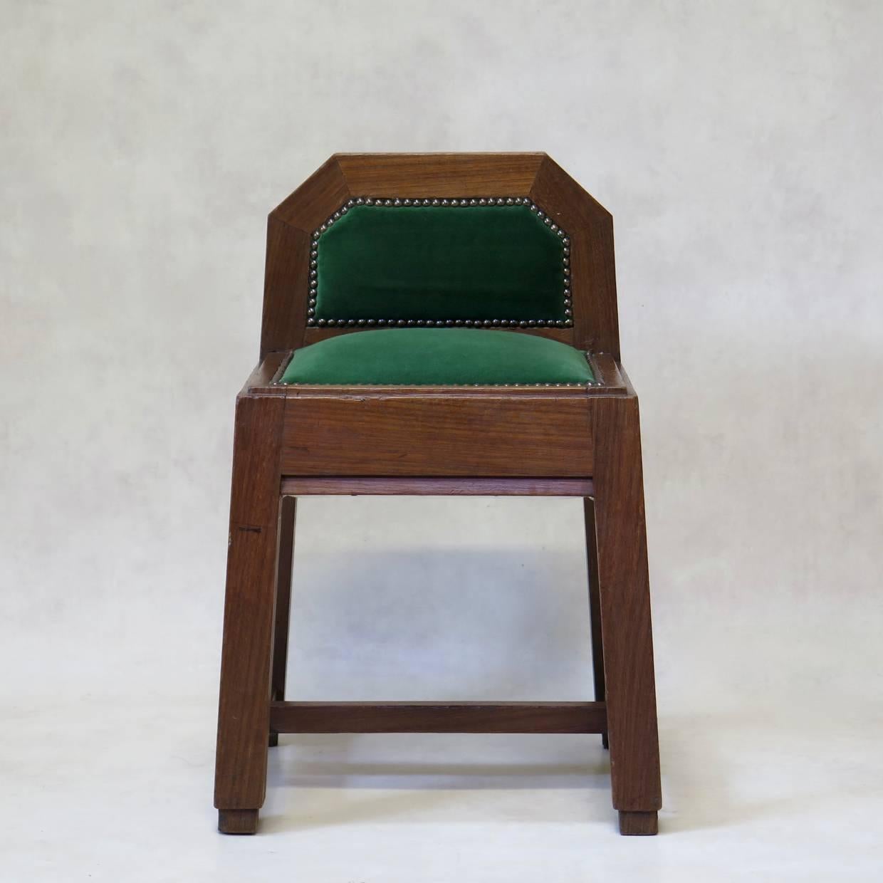 Solid and well-made pair of solid oak stools of unusual design. Elegant, with nice attention to detail. Newly upholstered in vintage green velvet.