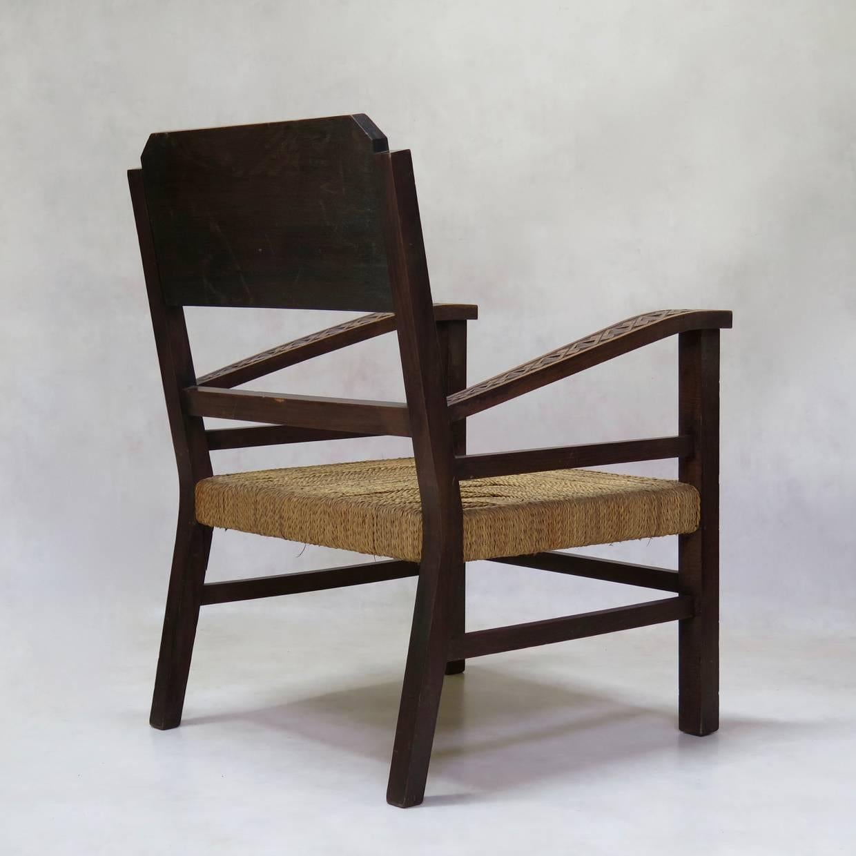 20th Century Pair of French Mid-Century Armchairs Carved with Geometric African Motifs