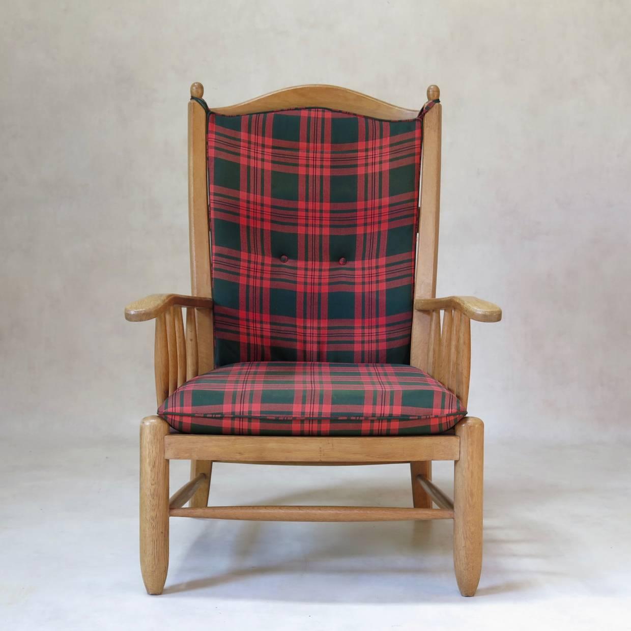Set of four brushed oak chalet-style armchairs with original tartan-motif seats and backs. 

In the style of Guillerme & Chambron.

Seat height (in centimeters): 40.