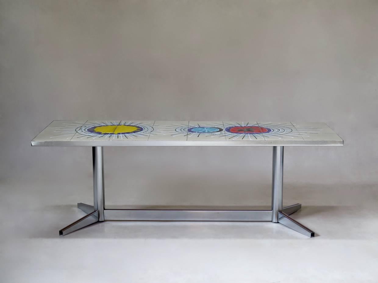 Rectangular coffee table with a chrome base and a colorful tiled top, by Belgian artist Juliette Belarti.