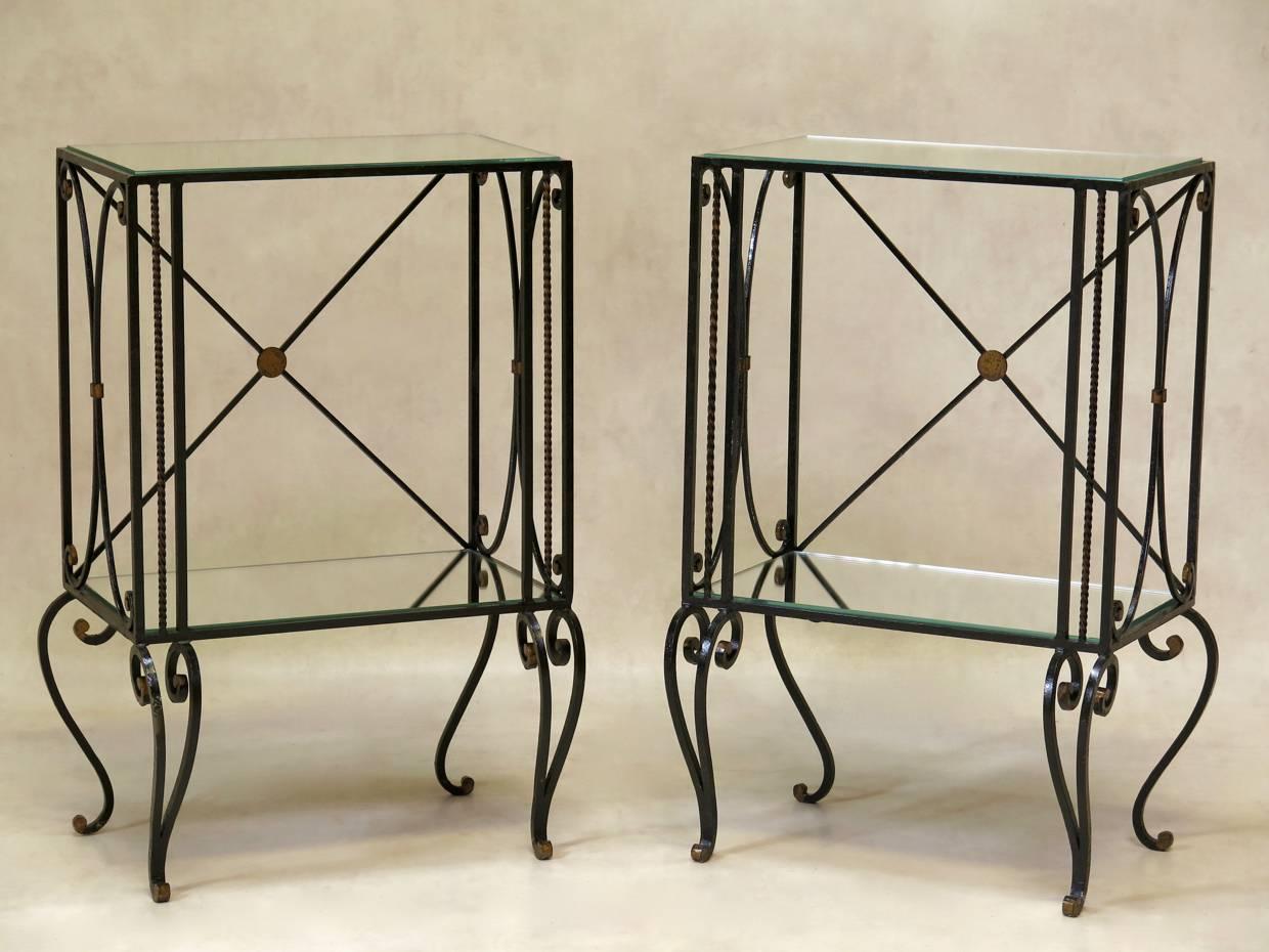 Chic and pretty pair of painted iron bedside tables with details picked out in gold. Mirrored shelves.