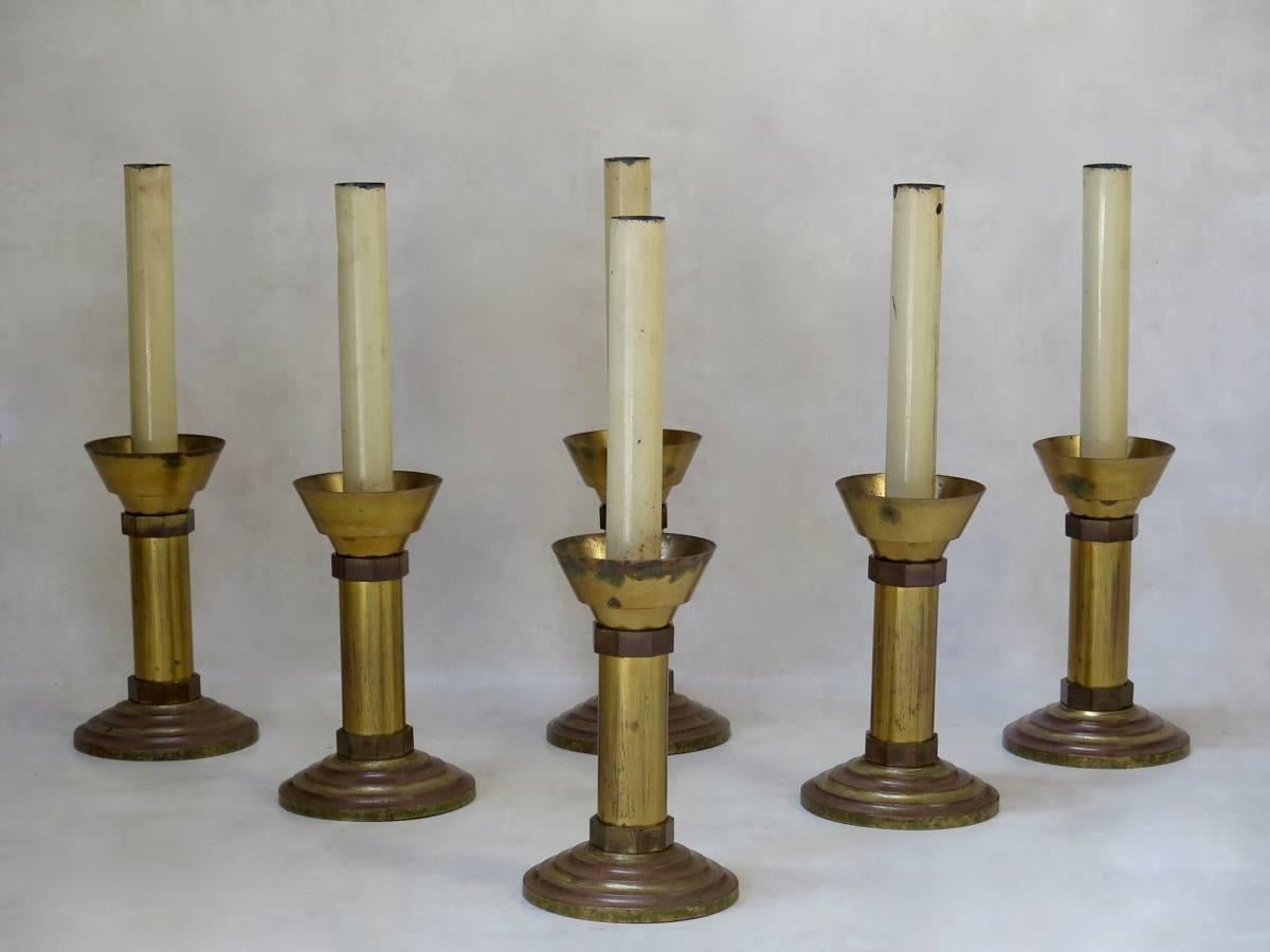 Set of six large brass and tôle peinte candlesticks from a church, plus a crucifix.

Dimensions provided below are for the candlesticks.