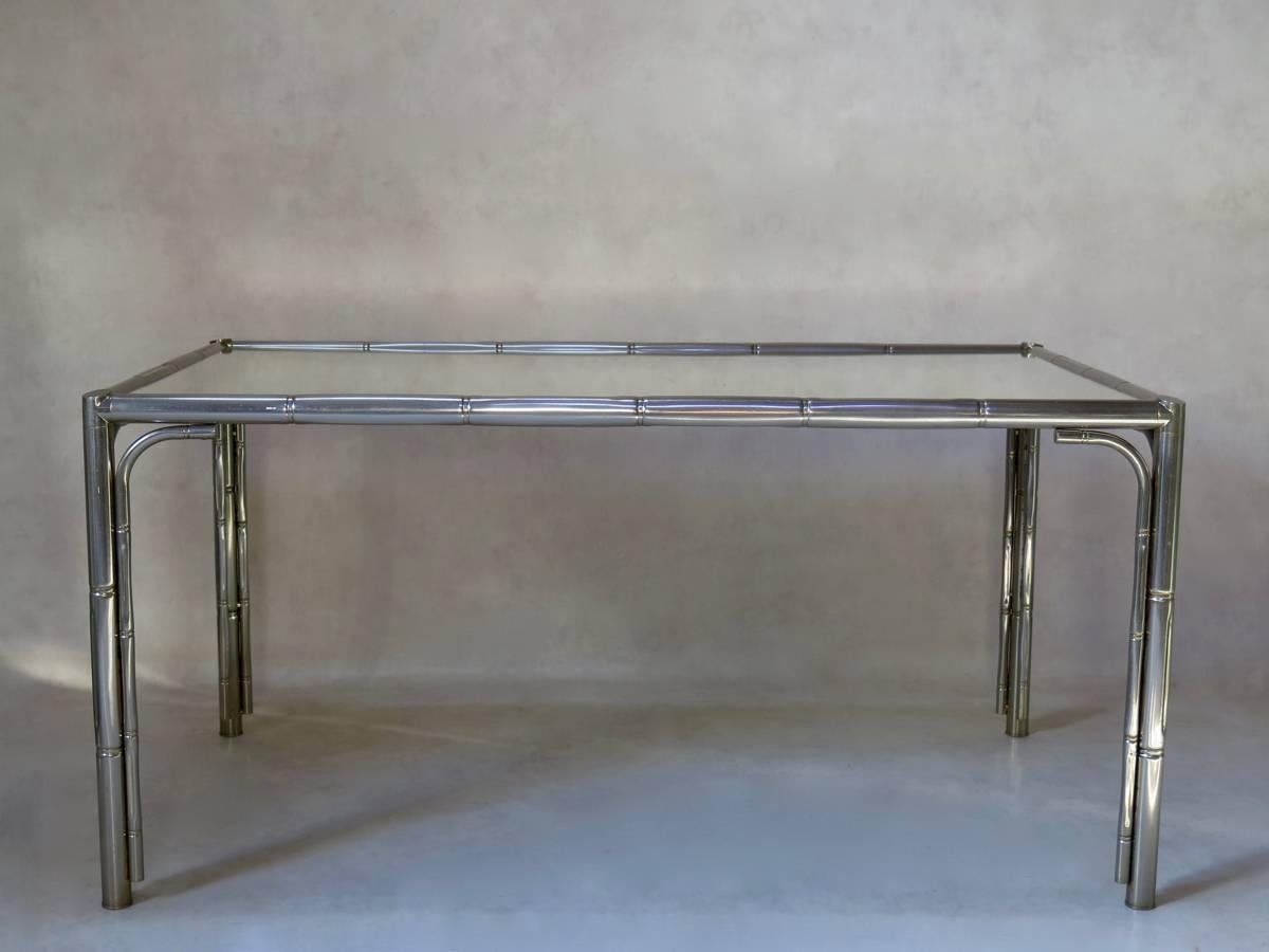 Nicely designed chromed metal dining table with a stylized faux-bamboo motif. Mirror top.