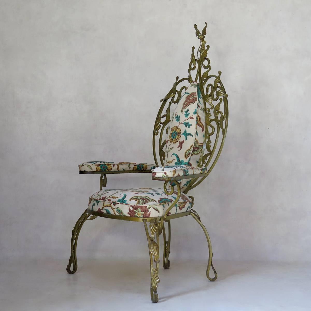 Fabulously over-the-top gilt iron armchair decorated with stylised acanthus leaves. Newly re-upholstered in vintage fabric. In the style of Pier Luigi Colli.