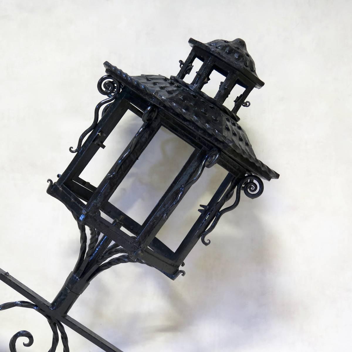 Glorious pair of pagoda-shaped wrought iron wall lights. Can be used inside or out.