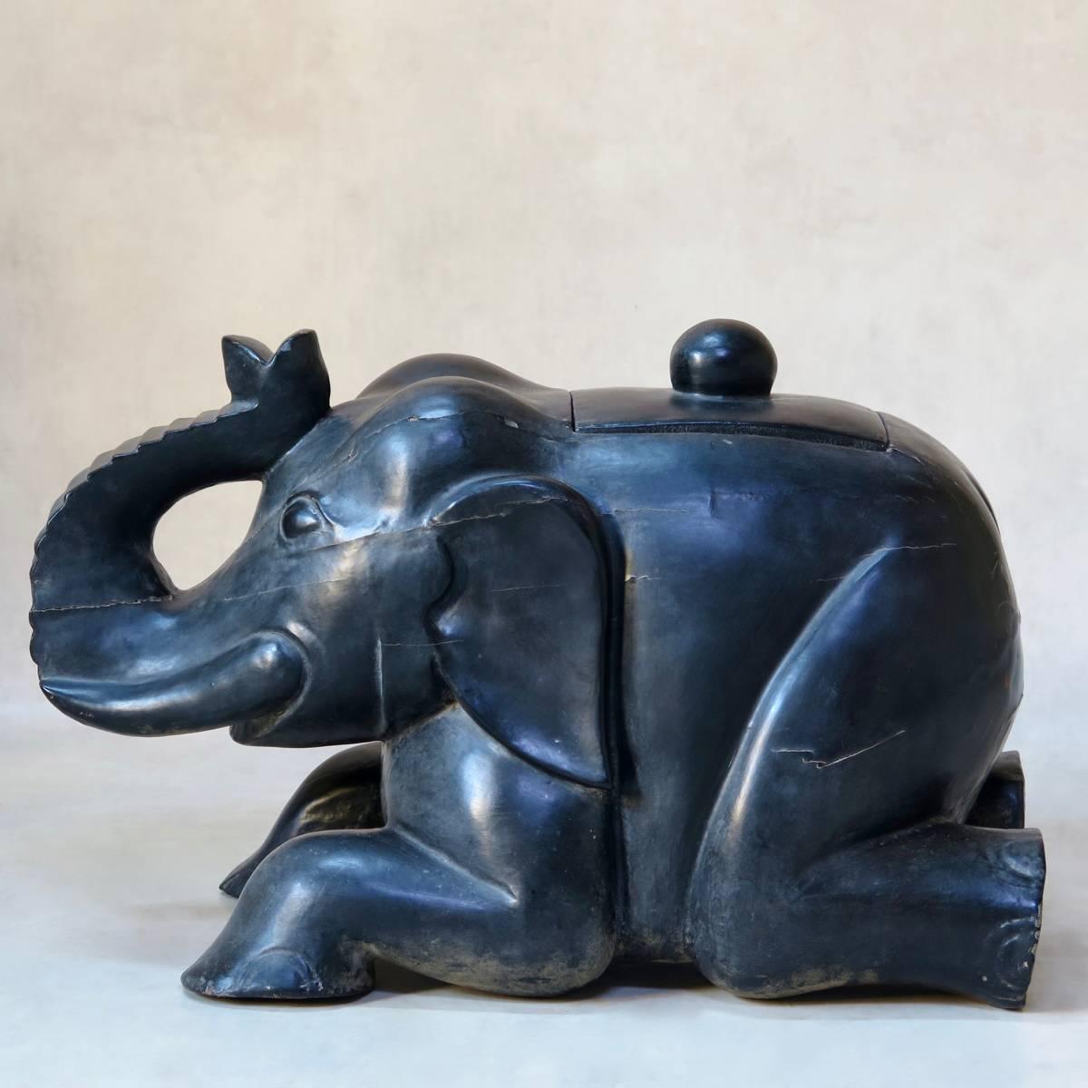 Whimsical and very decorative carved elephant, with a top 