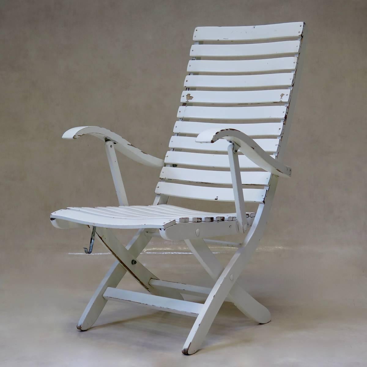 Elegant and practical set of Classic-design slatted deck chairs with armrests. Two positions -- one more upright and the other more reclined.