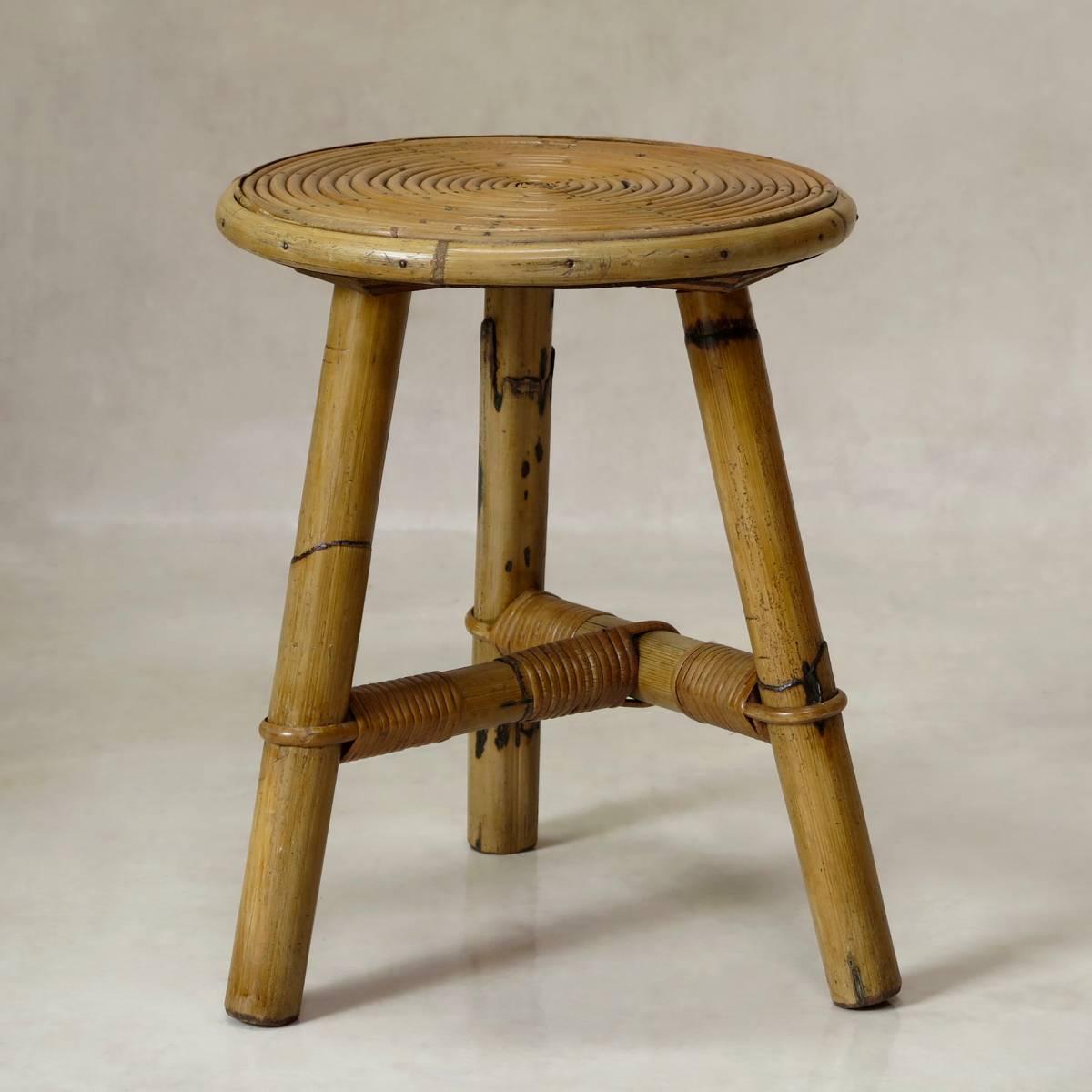 Pair of light, cane wicker tripod stools with unusual seats, running in concentric circles.

(Table also available).