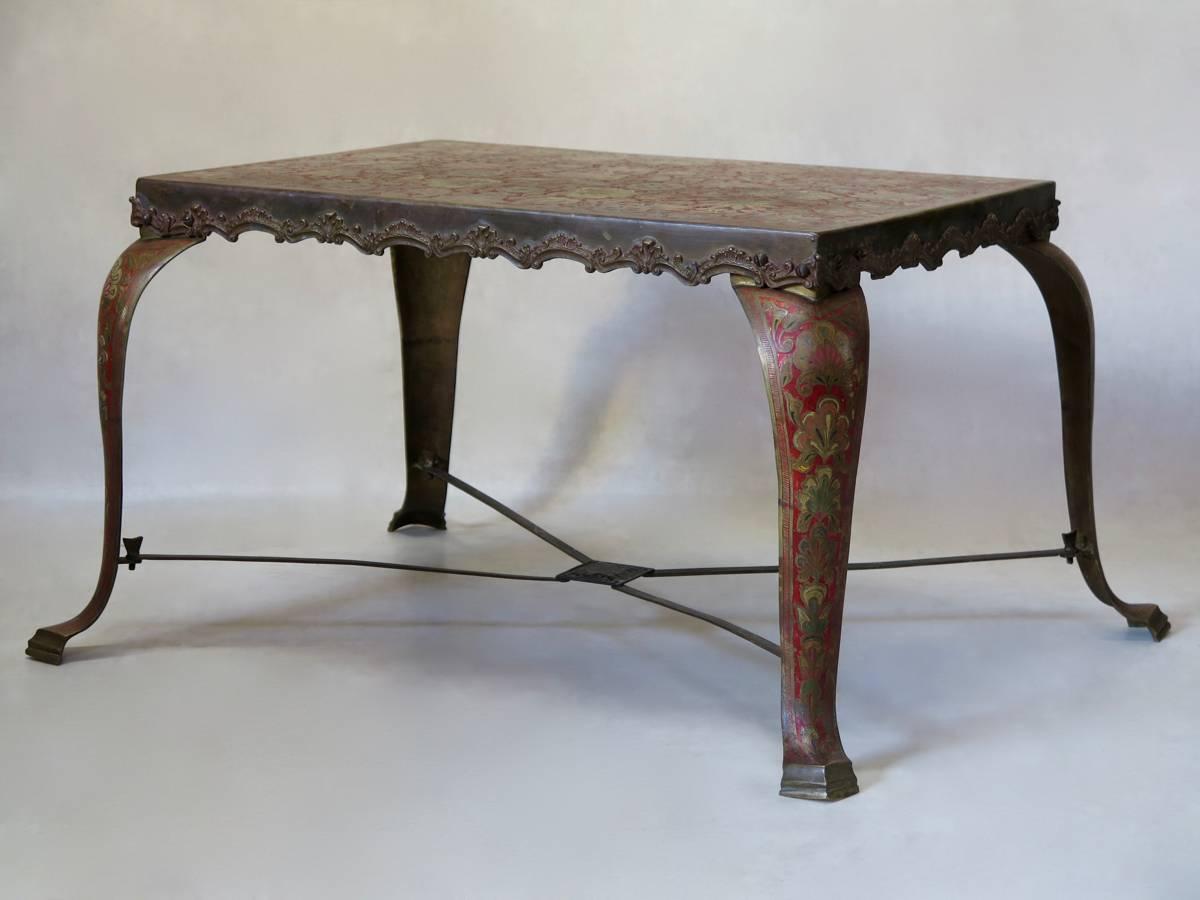 Elegant and unusual side table made of brass with a cloisonné paisley motif. Raised on chunky cabriole legs, joined by an X-shape stretcher. Possibly Anglo-Indian.