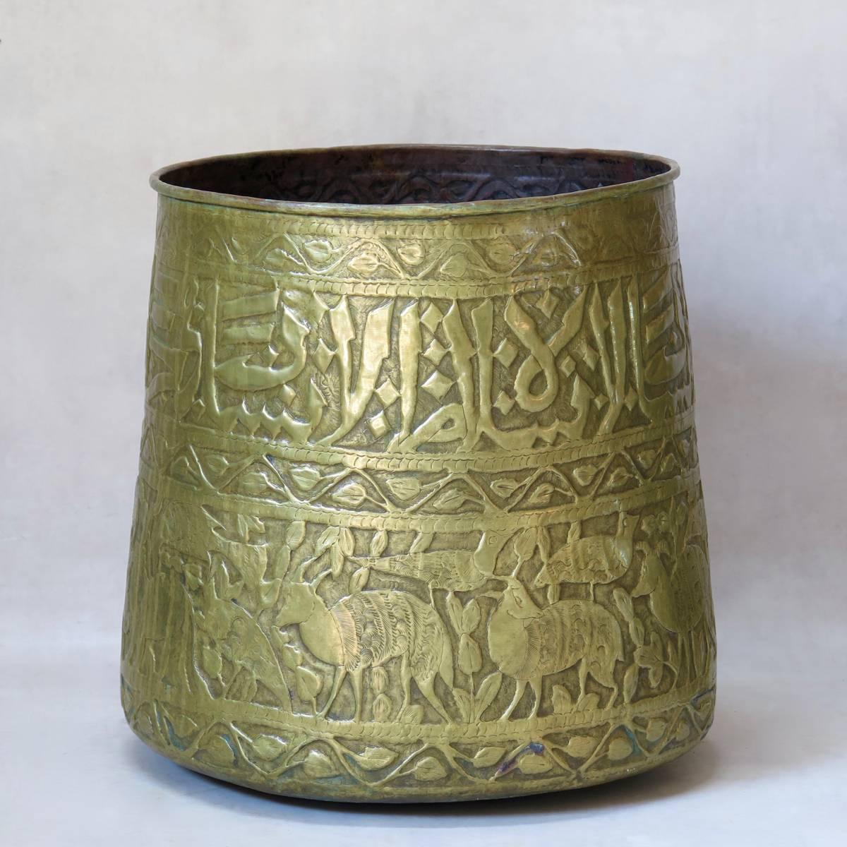 Lovely pair of large oriental copper planters (cache-pots) embossed with decor of arabic calligraphy, animals and foliate friezes.