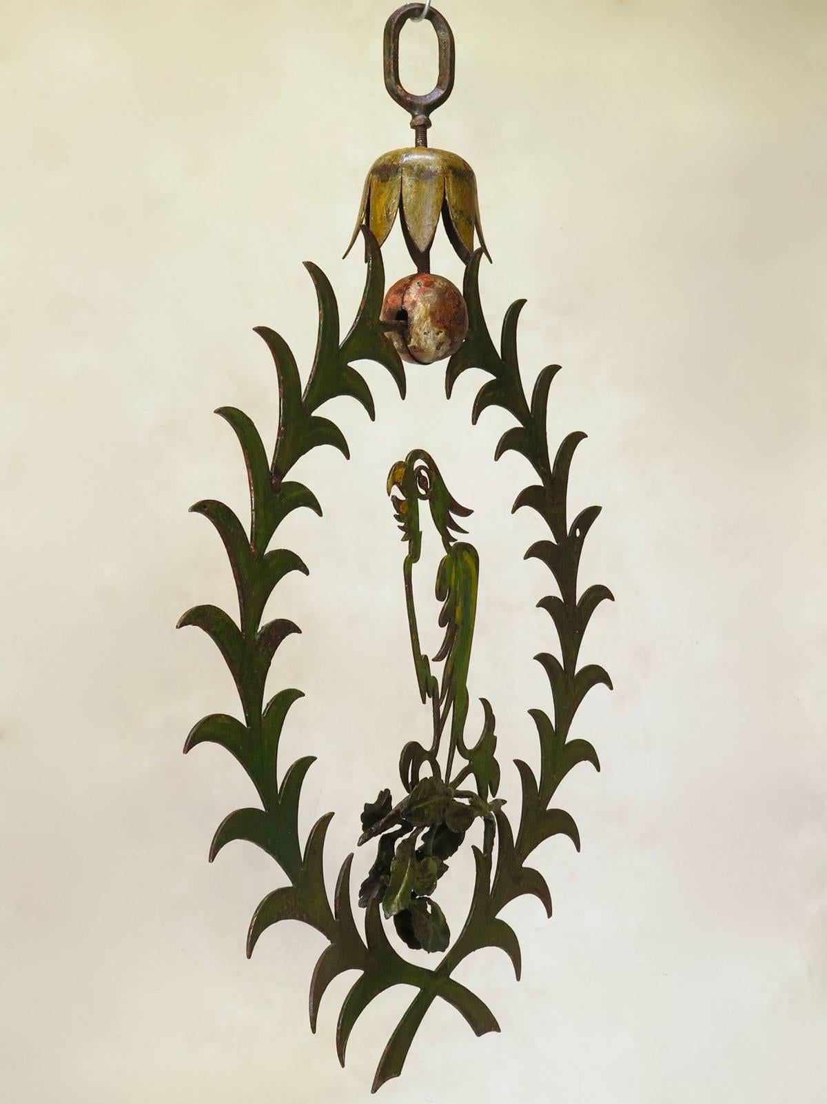 Large iron sign representing a parrot on its perch. Painted with lovely greeny yellow colours. This sign used to hang in front of a French Maison Close (bordello), at the beginning of the 20th century.