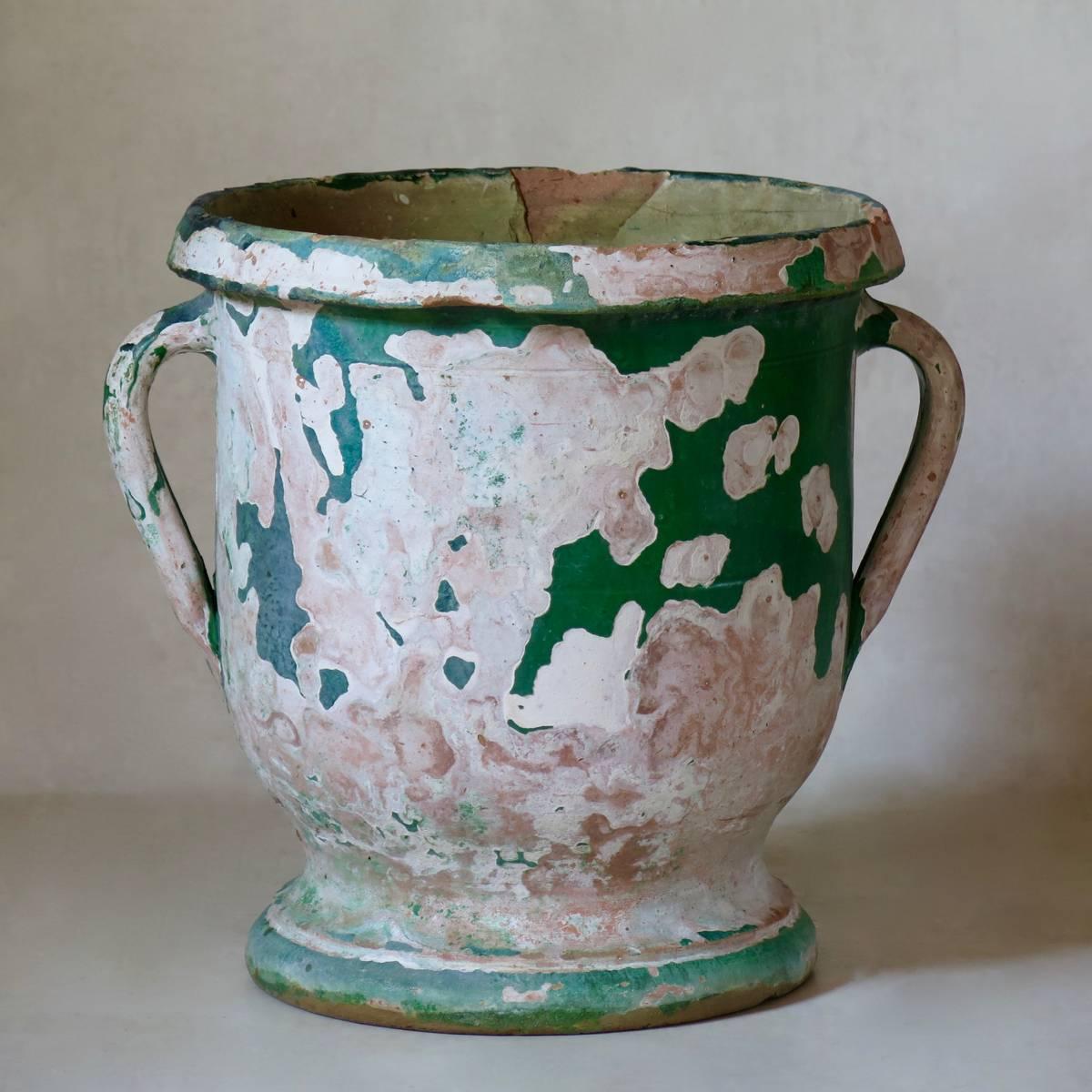 Charming planter from Anduze, with two handles around the top. The beautiful deep green glaze has largely worn off, especially on one side.
 