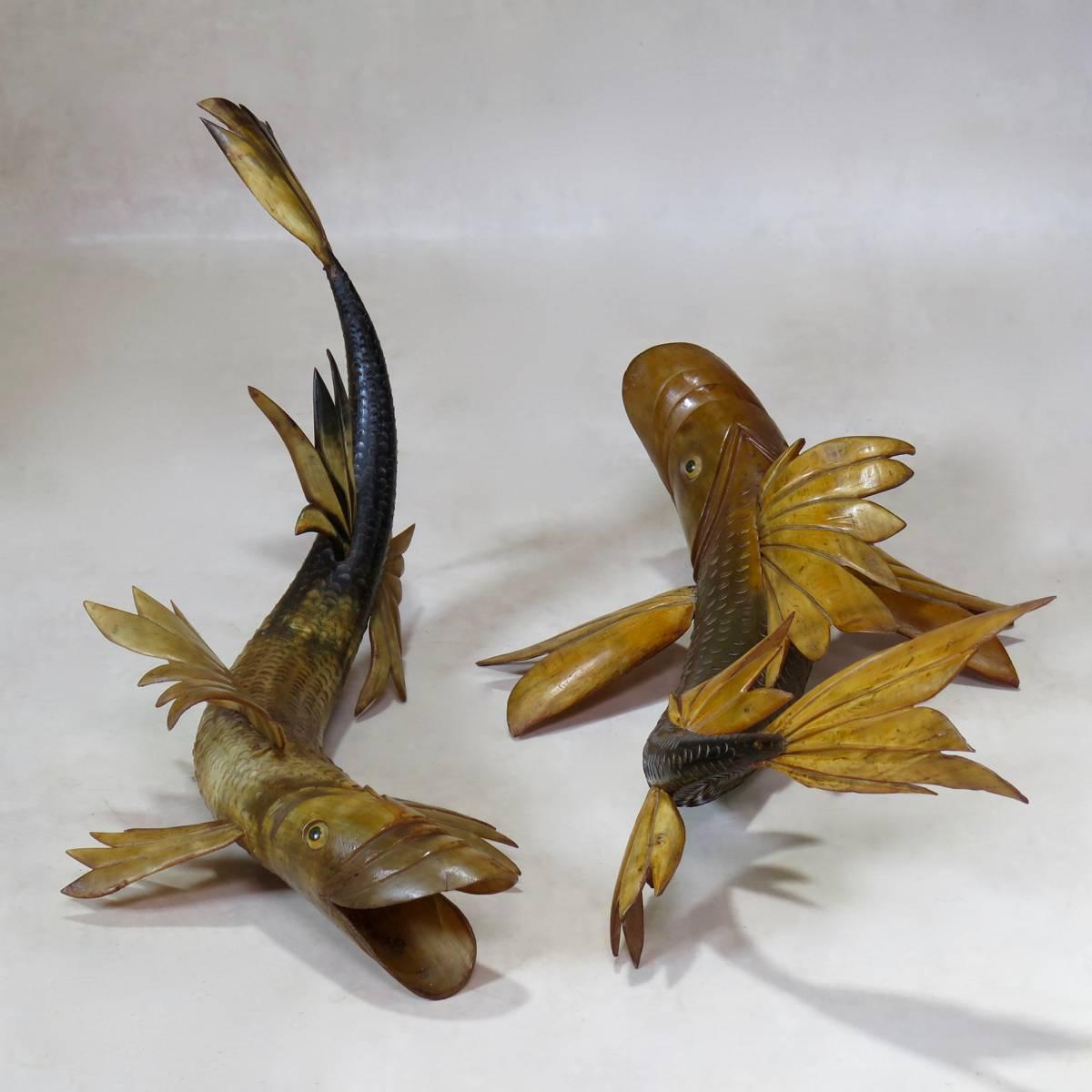 Fun and unusual pair of fish sculptures hand-fashioned out of a large pair of bull horns. Very decorative. Could also be made into lamps.