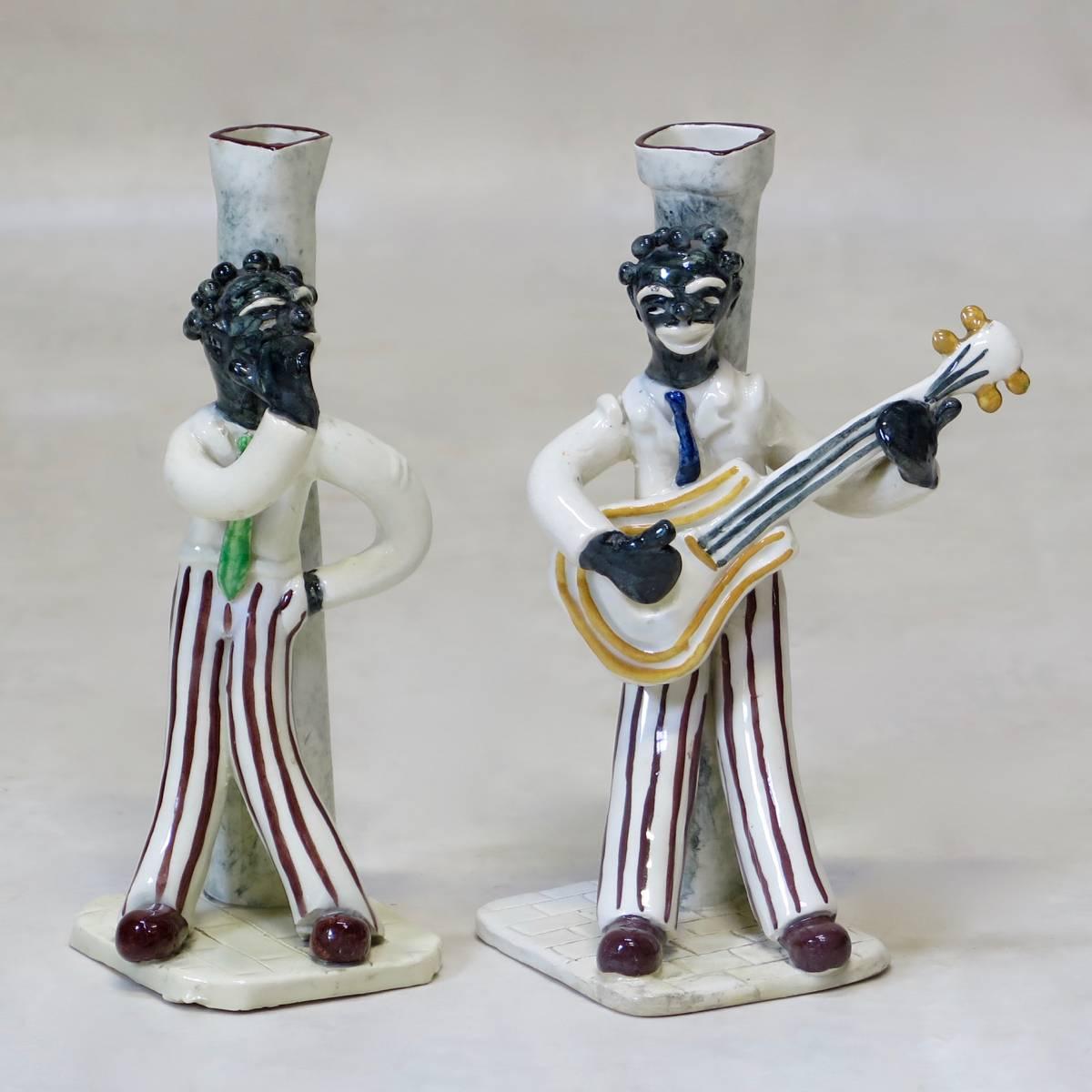 Charming pair of porcelain candlesticks representing musicians from the 1920s-1930s.