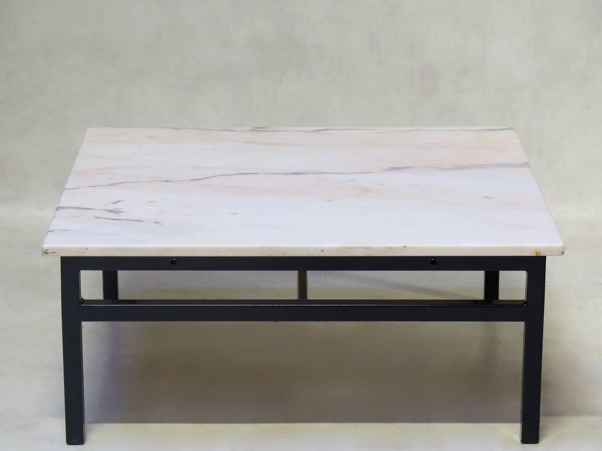 Minimalist square coffee tables with a marble top and iron base. Eight available.