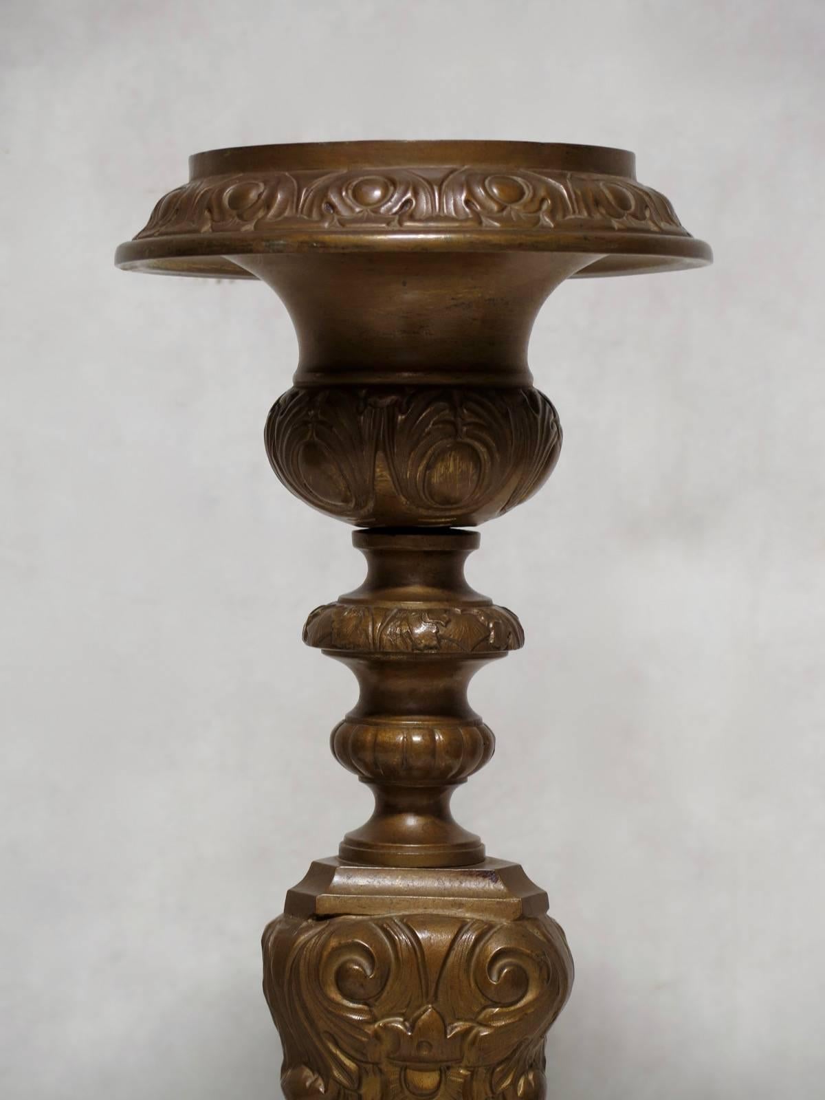 Tall and elegant pair of repoussé copper baroque, Louis XV style pricket sticks.