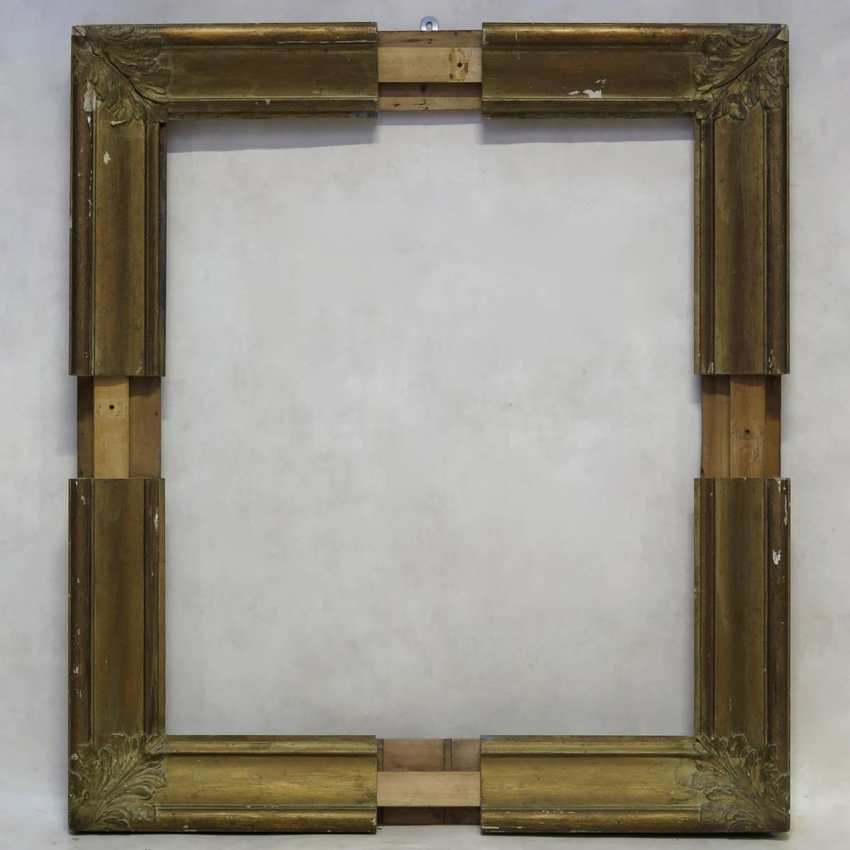 Very rare and unusual pair of giltwood picture frames that are adjustable in width and height, decorated with large acanthus leaves in each corner. One small and one large.

Dimensions provided below ("fully-deployed") are for the larger