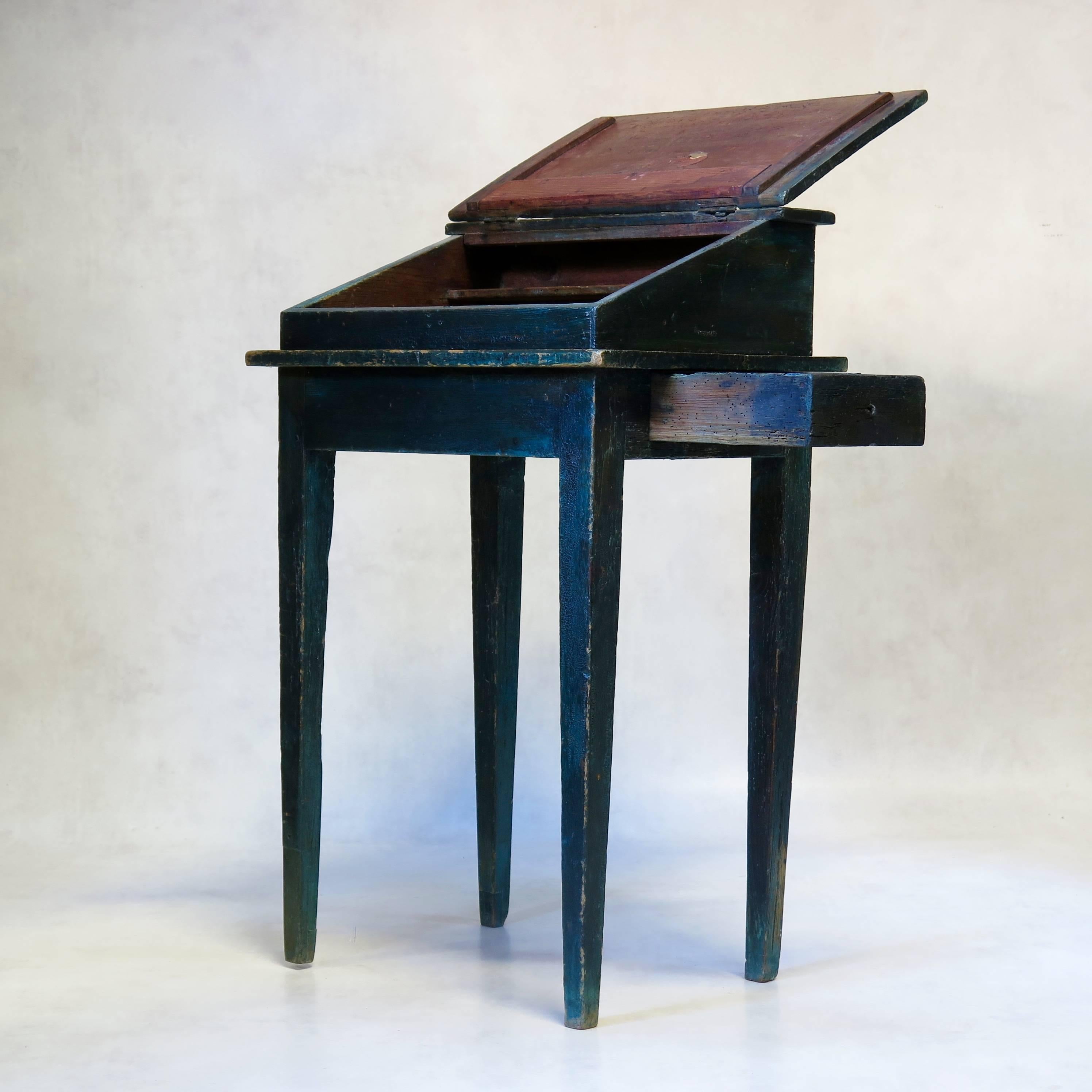 Charming and petite slant top writing desk with a secret little drawer hidden in the side. Lovely deep sea green color with nice patina.