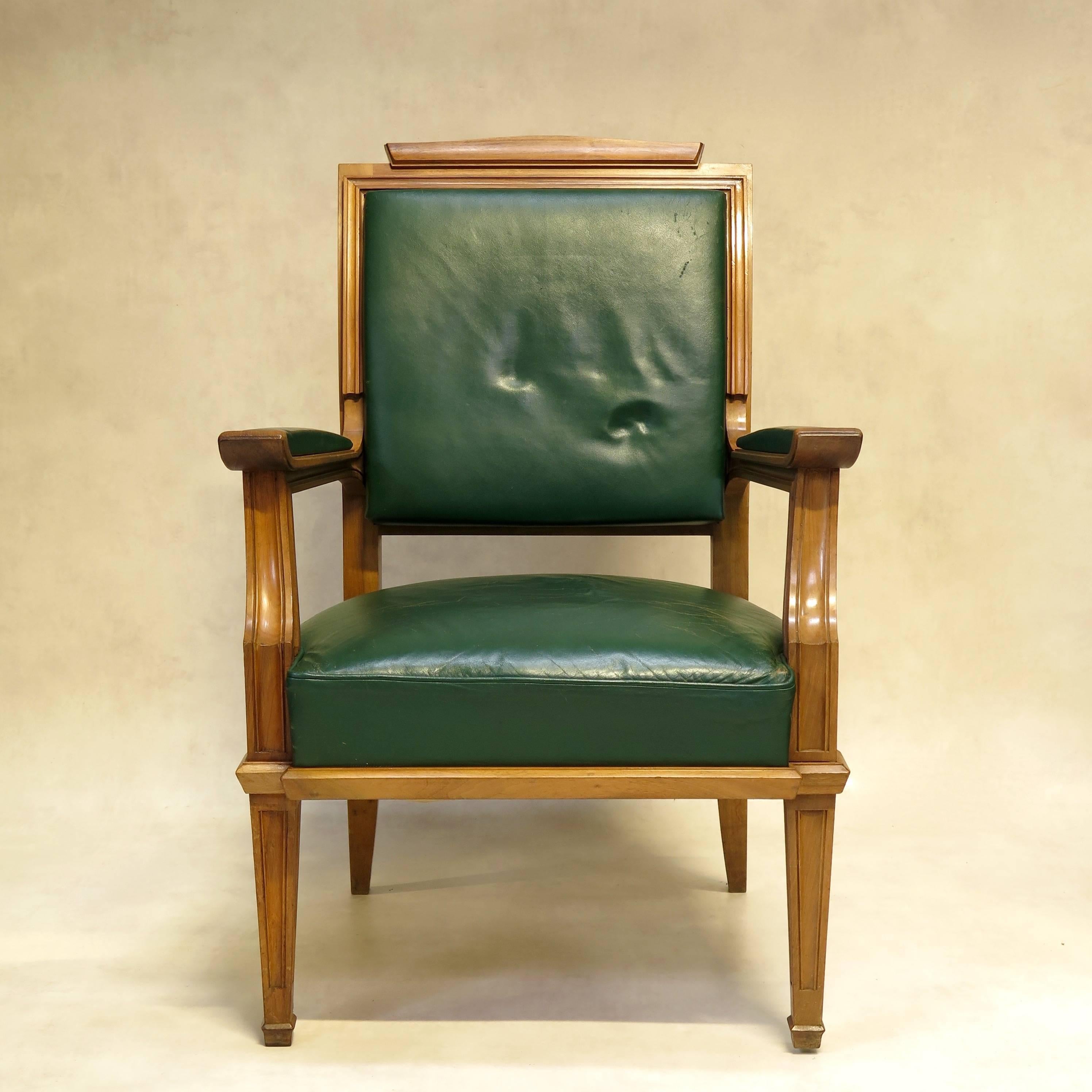 Chic Art Deco 1940s desk chair in blond walnut with original dark green upholstery.