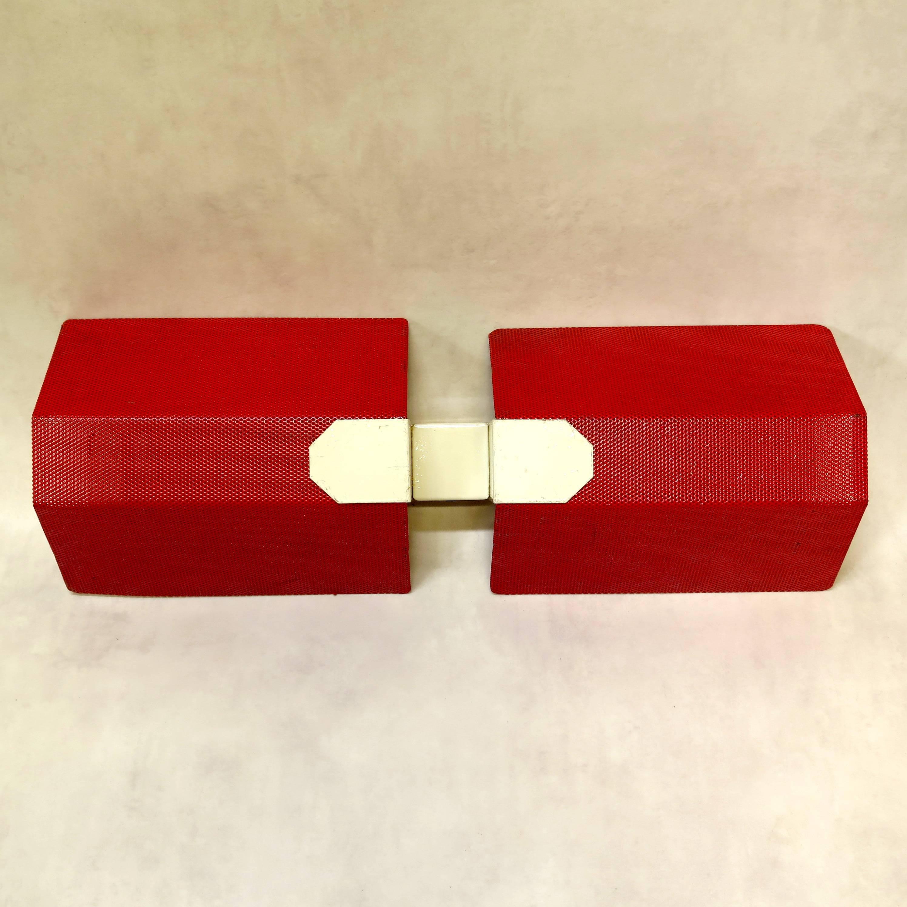 Fabulous set of nine red and off-white lacquered wall lights in the style of Mathieu Matégot. Each sconce holds two bulbs, one uplighter and one down lighter. Can be used horizontally as well. 

Nice, graphic bow design.