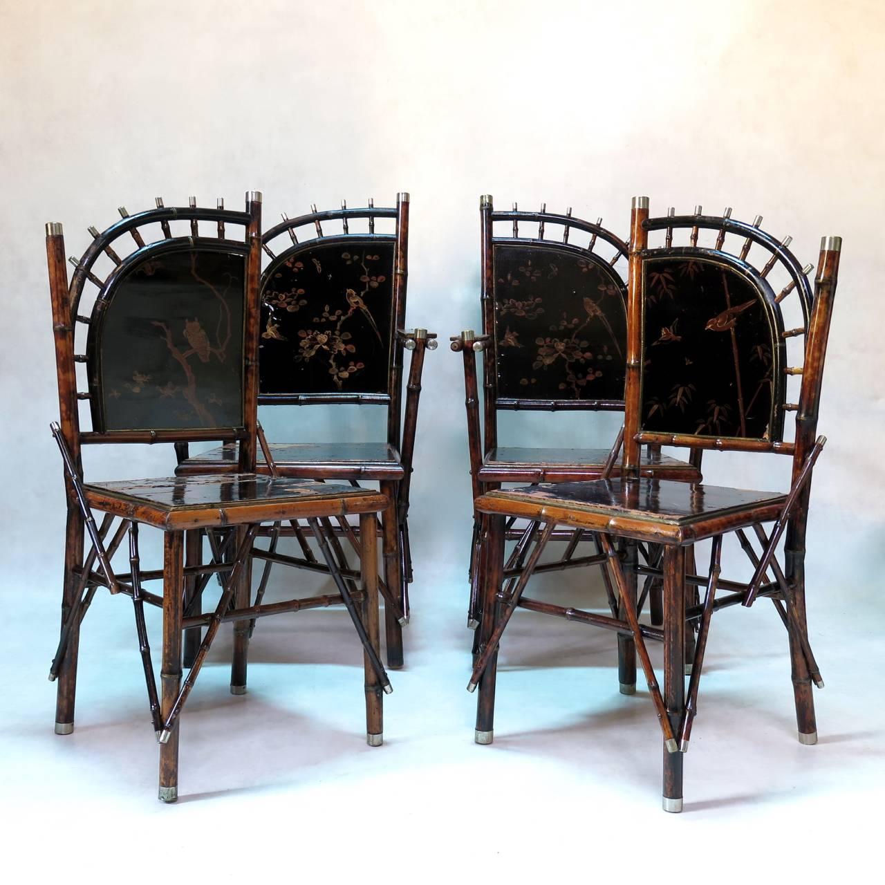 Very unusual set of Napoleon III era Japonisme-style dining room chairs (six chairs and two carvers). 

The spindle backs fan upwards and outwards. 
 
Faux-bamboo structure (some with a speckled tortoiseshell effect), ending in metal caps