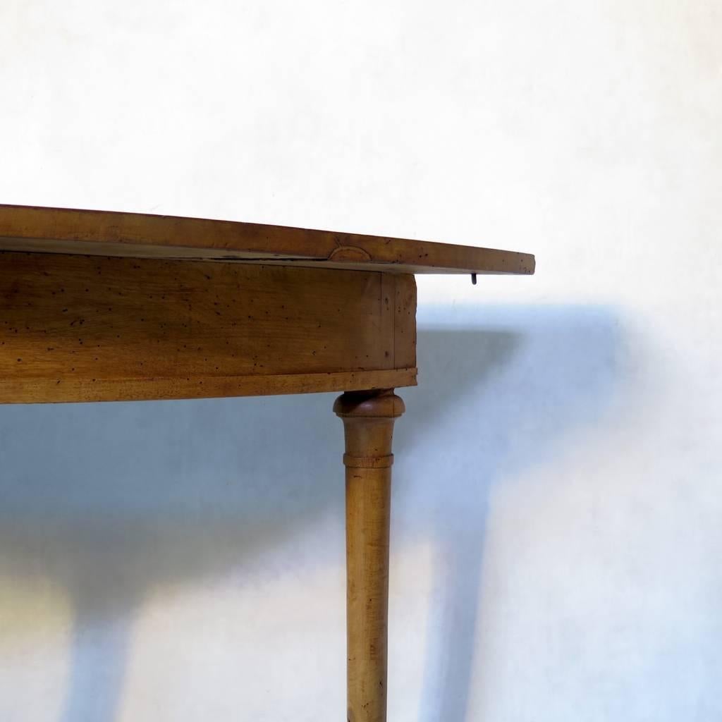 Very elegant pair of console tables odd unusual, slender and elongated demilune shape. Made of walnut.