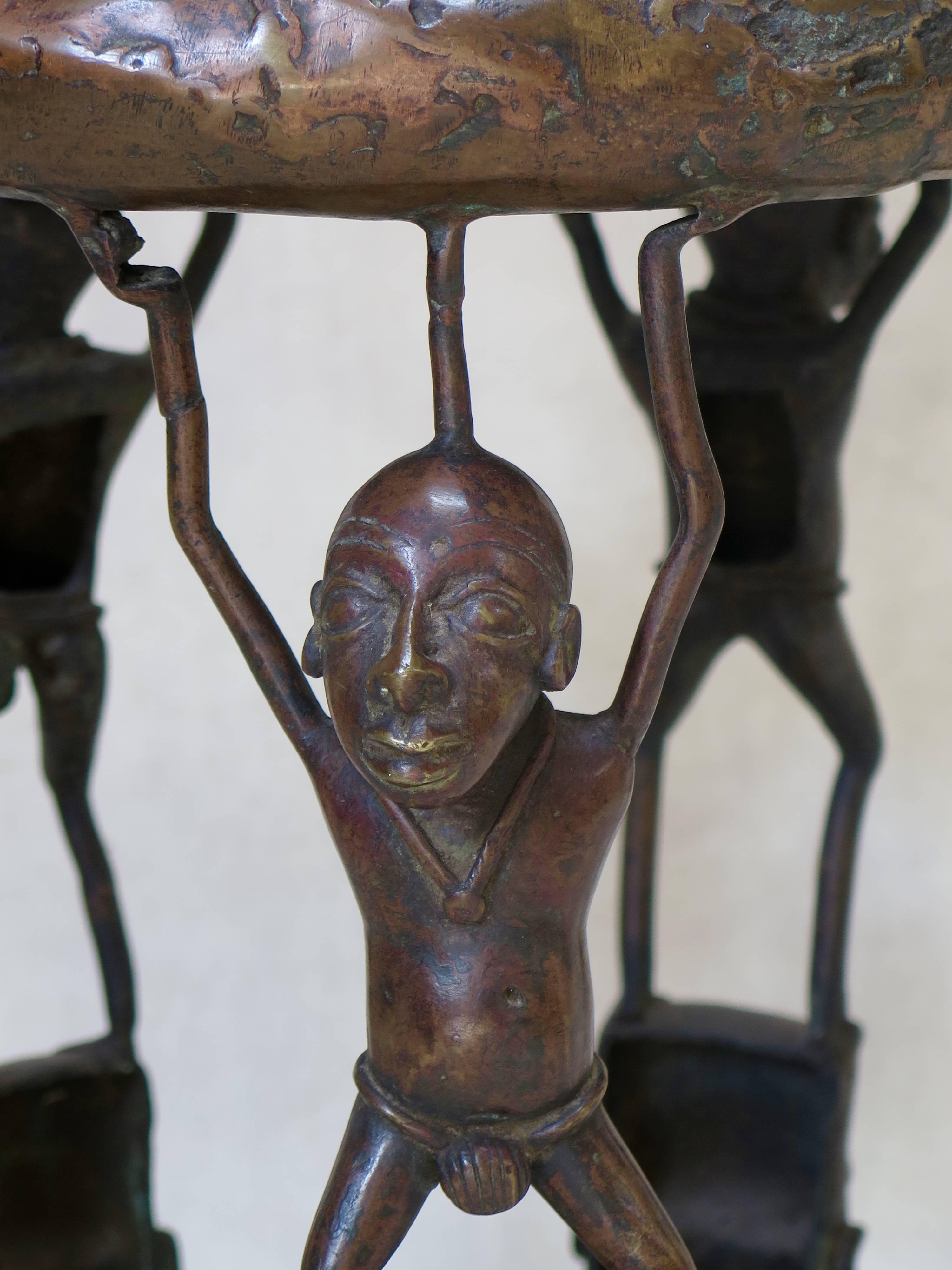 Very lovely bronze stool with nice patina. The seat is decorated with a spider.
