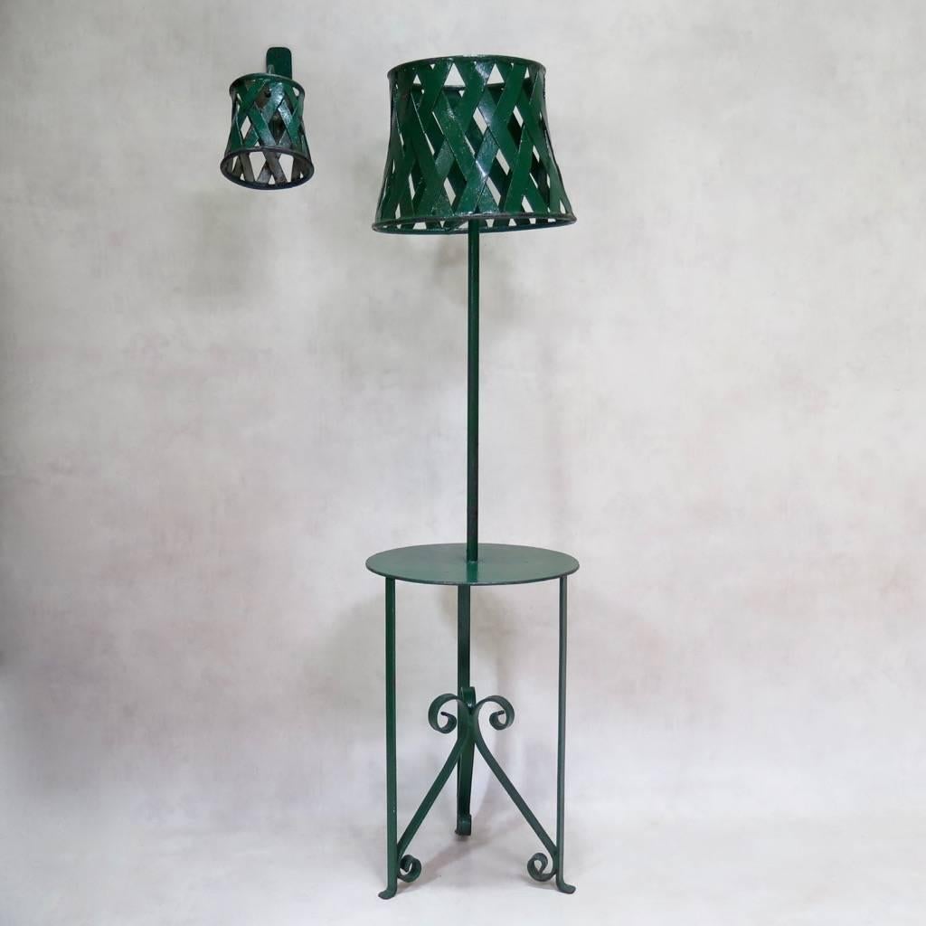 Charming lighting set comprised of a side table / floor lamp, plus four sconces. The set is made of iron, with original green paint.

Dimensions provided below are for the floor lamp. The sconces measure (in centimeters):

Height: 27
Width: