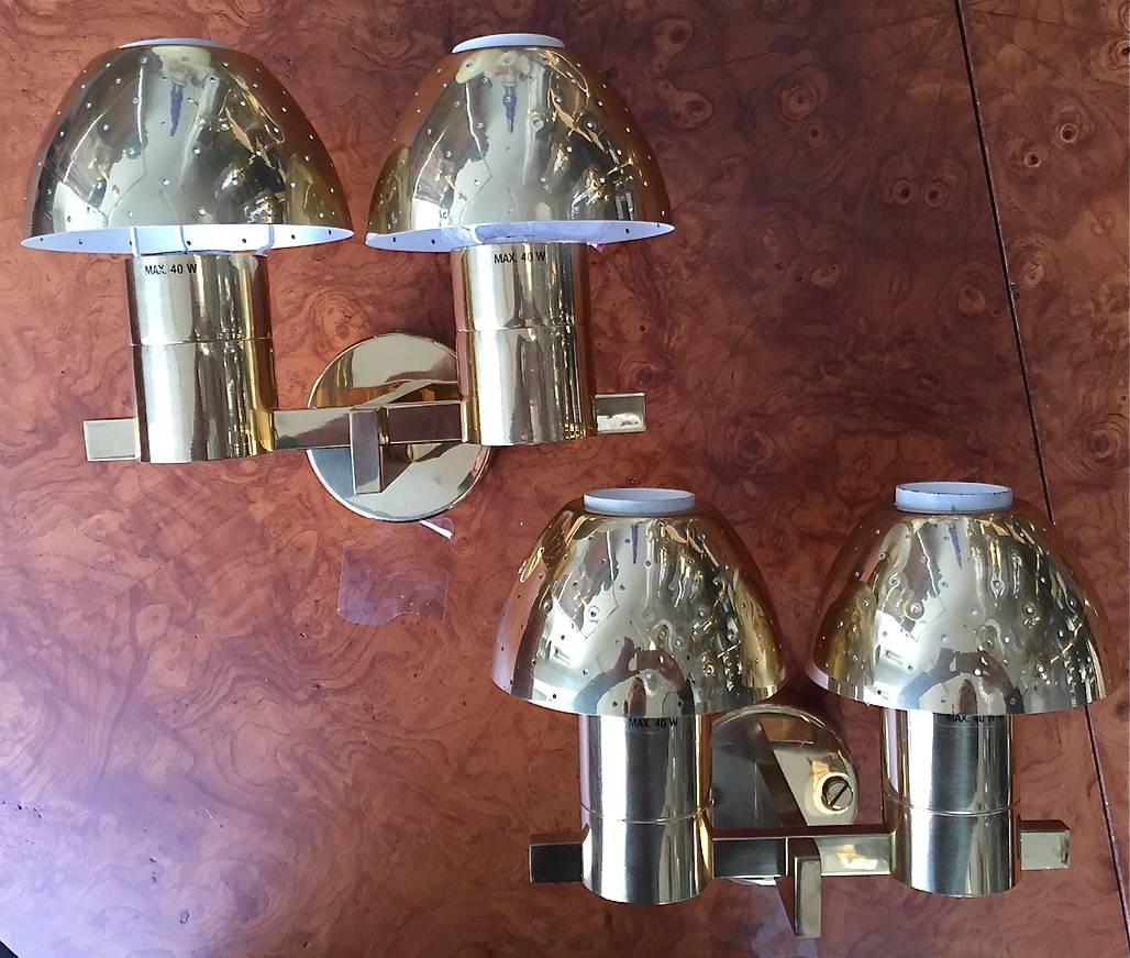 A pair of wall lights by Hans-Agne Jakobsson, Sweden, circa 1960s.
Polished brass with perforated shades.
Existing wiring, we do not guaranty functionality, rewiring available upon request.