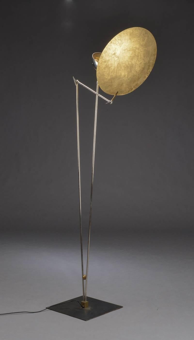 A tall floor lamp by Castellani & Smith, Italy, circa 21th century. Nickel-plated stem with cold leaf colored diffuser and iron foot. H. approx. 199 cm. (78