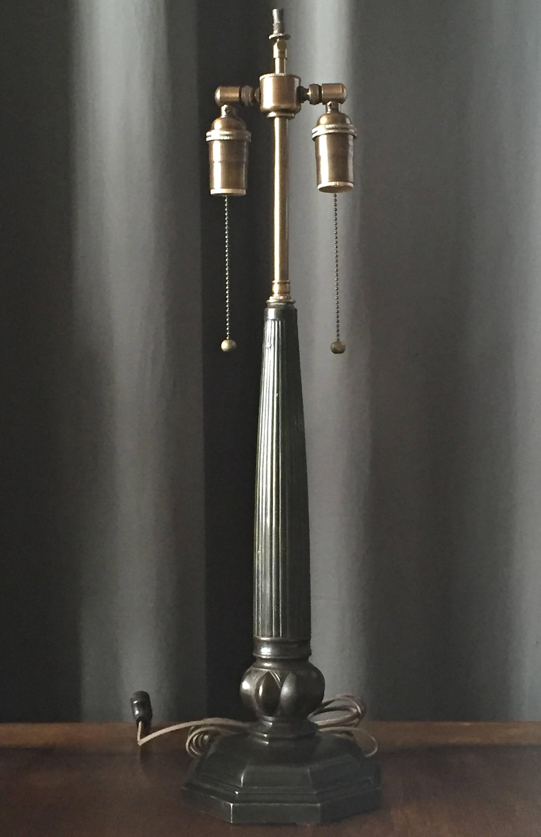 A table lamp designed by Just Andersen. Sweden, circa 1940.
patinated disco-metal. Newly rewired. Marked JustA model 2288.