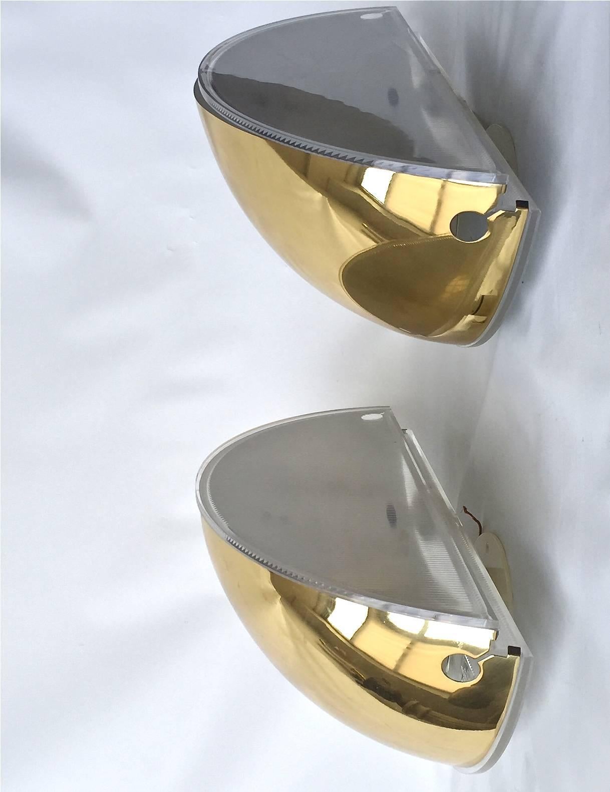 A Pair of extra large wall lights  designed by Tobia Scarpa, produced by Flos, Circa 1970th.
 Uplight wall light with curved polished  brass shades and plastic diffuser. W -16