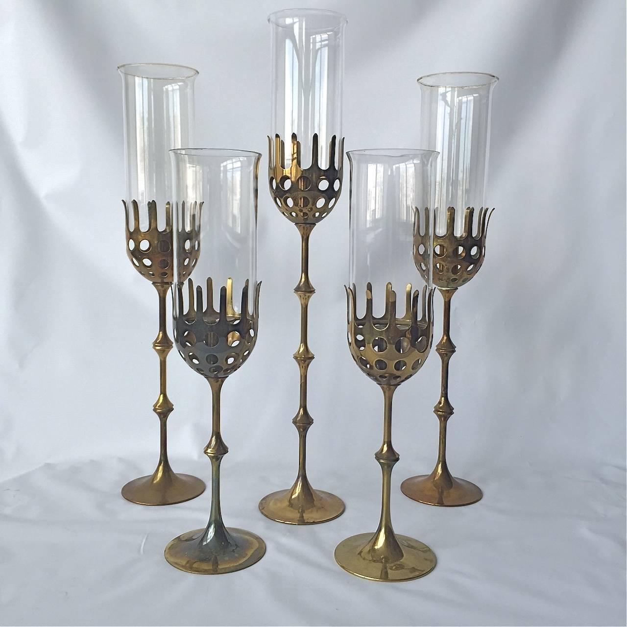 Set of 5 Hurricanes by Bjorn Winblad. 1918-2006, Denmark.
 Polished brass and glass.
 Height adjustable with interchangeable links. Diam. 4 
