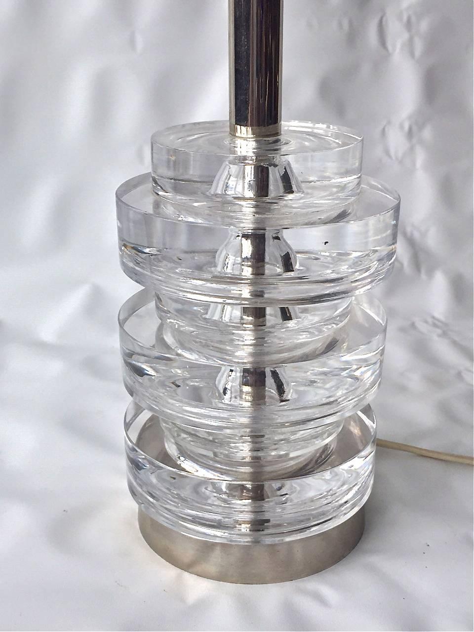 A table lamp designed by Carl Fagerlund for Orrefors, Model RD 1989, Sweden, circa 1970s. Polished chrome finish with crystal glass disks.
Measures: Diameter 4.5